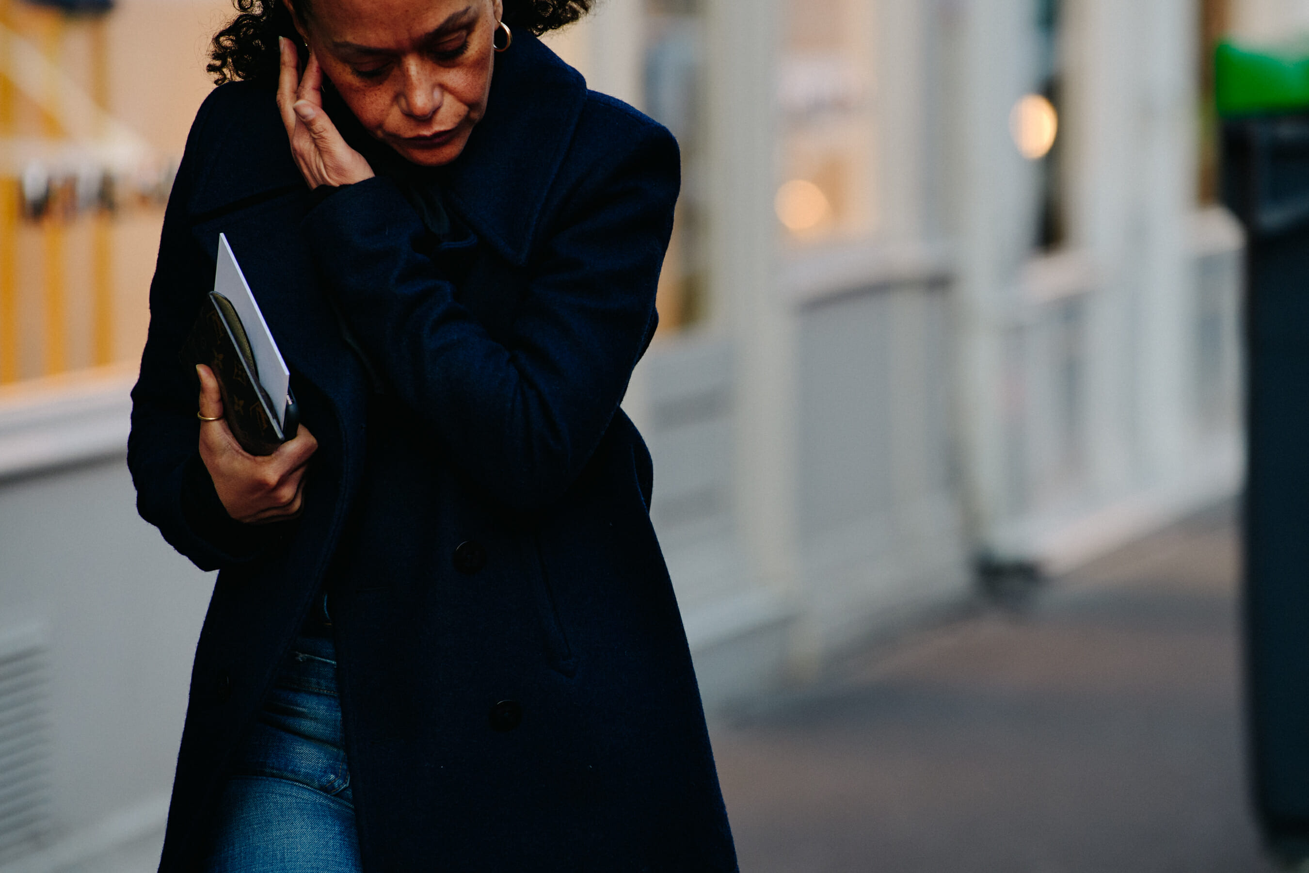Woman wearing navy coat