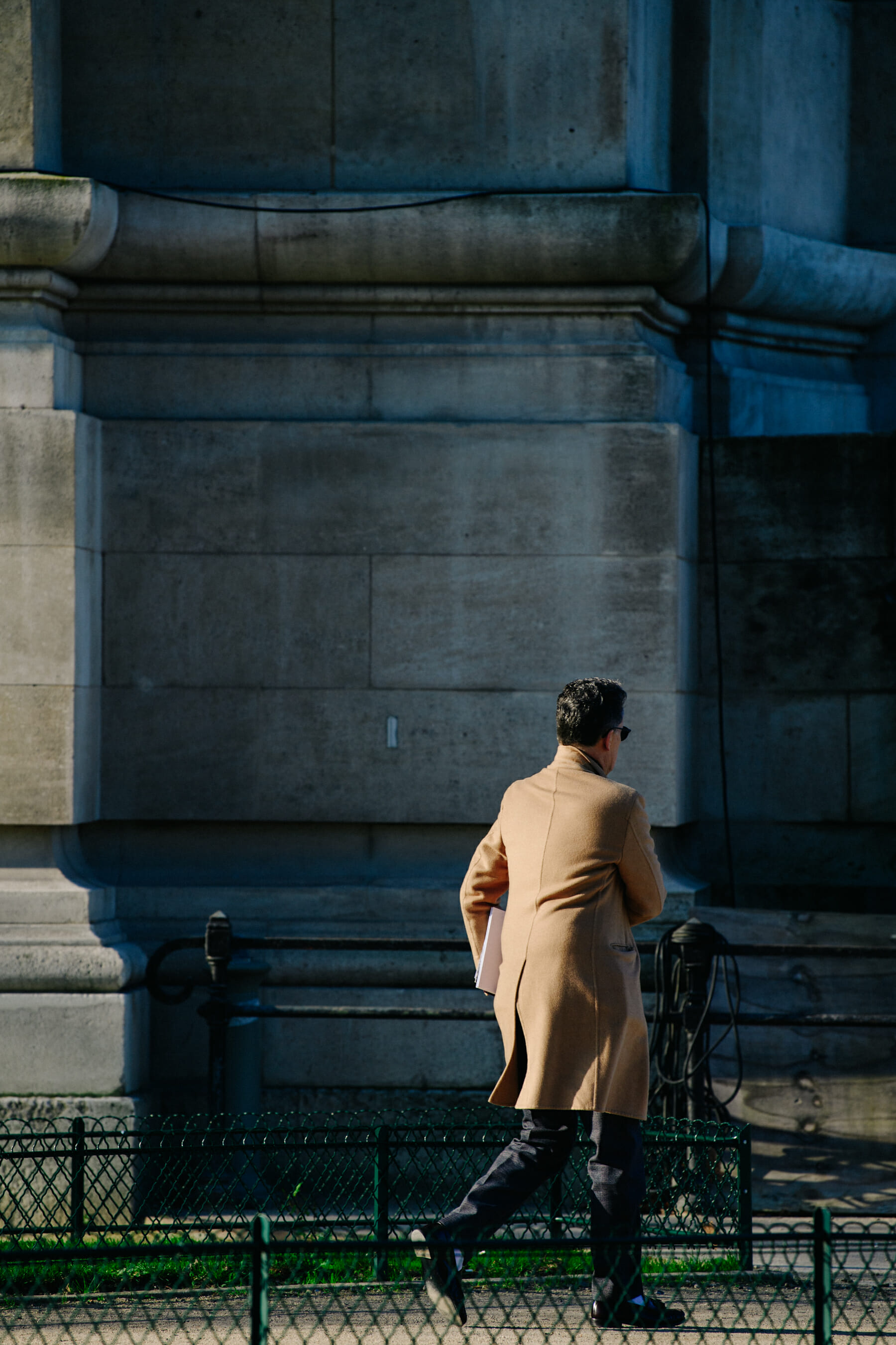 Man wearing tan coat