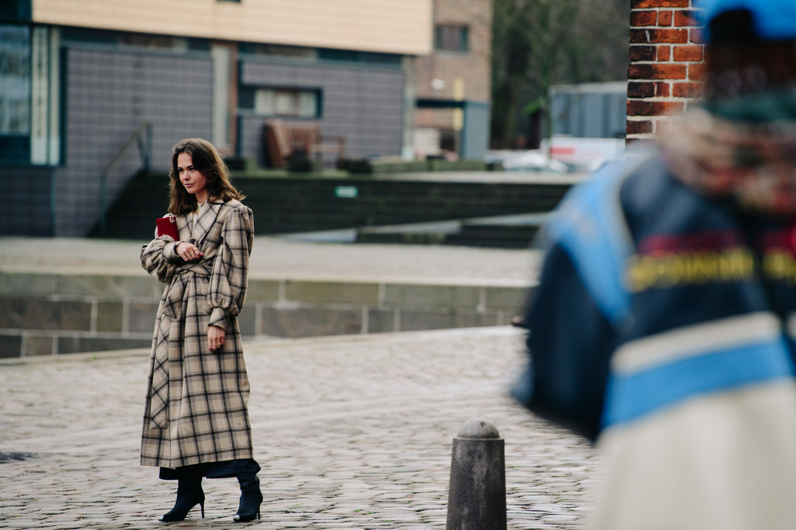 Woman wearing check coat