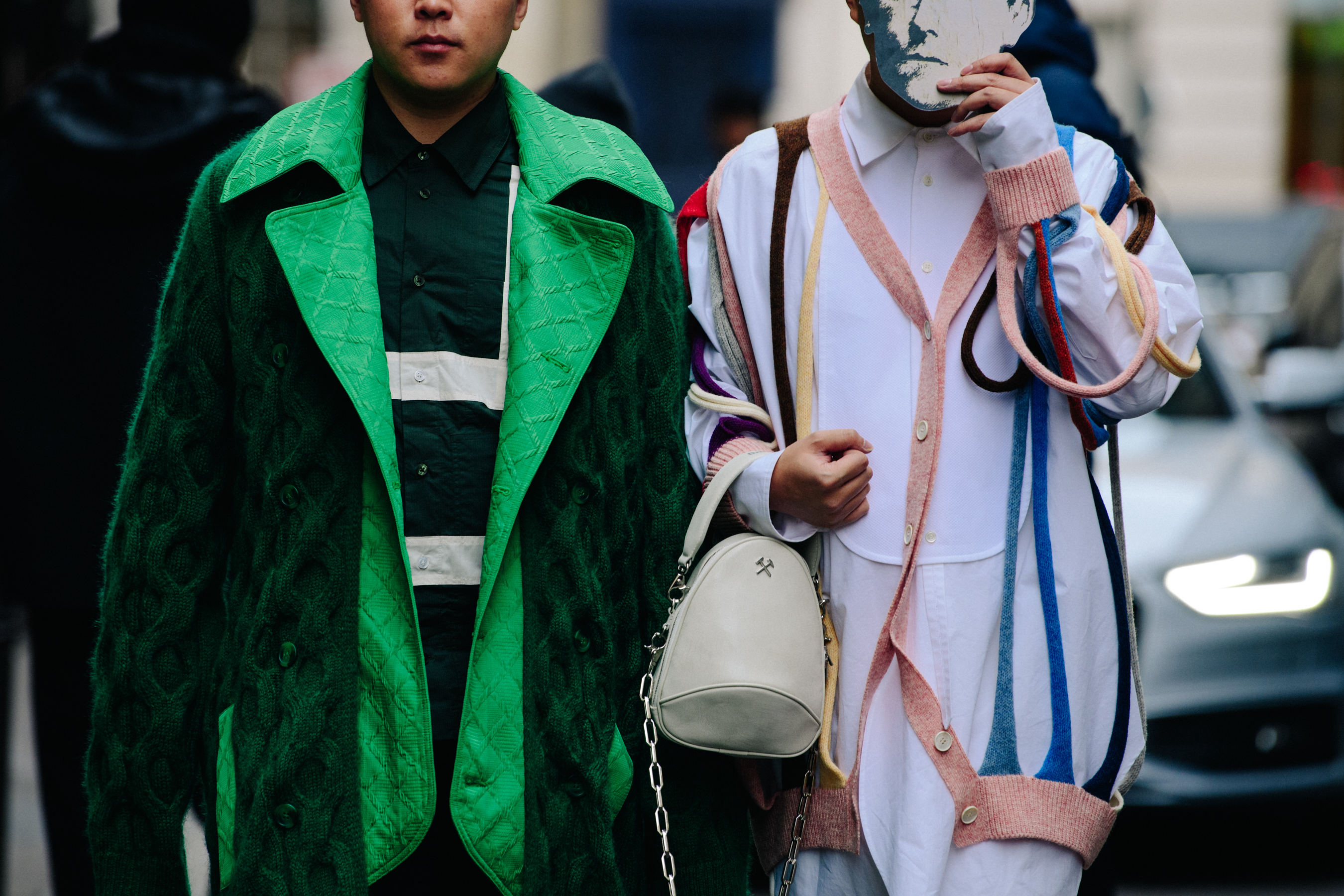 Two men wearing green and white