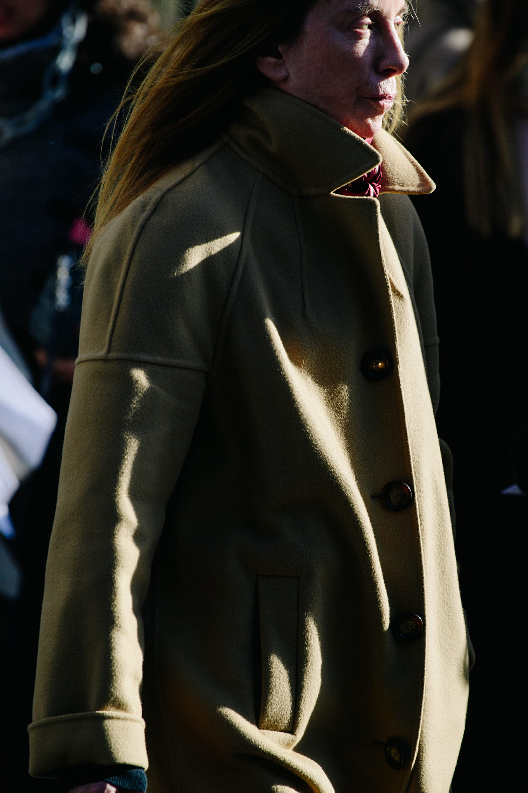 Woman wearing tan coat