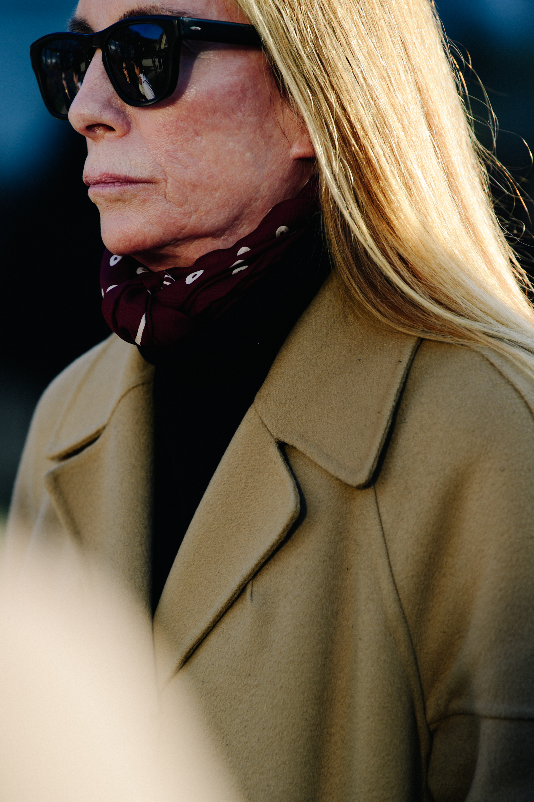 Woman wearing tan coat