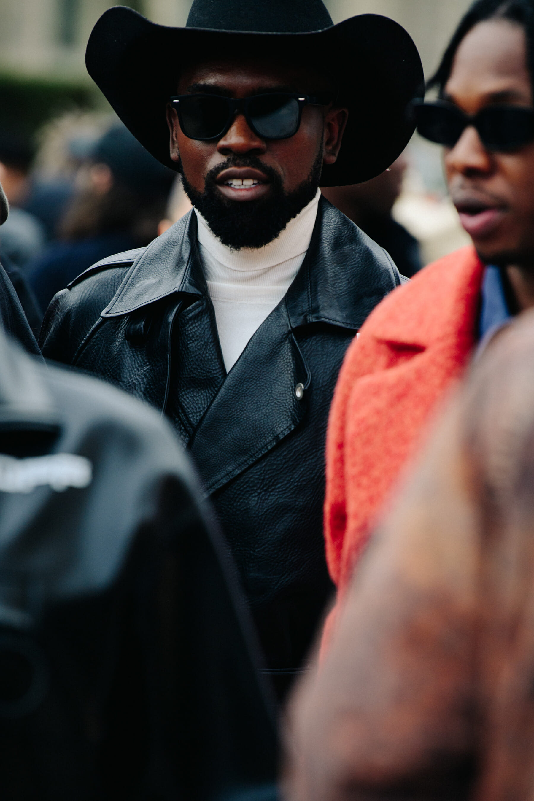 Man wearing black cowboy hat