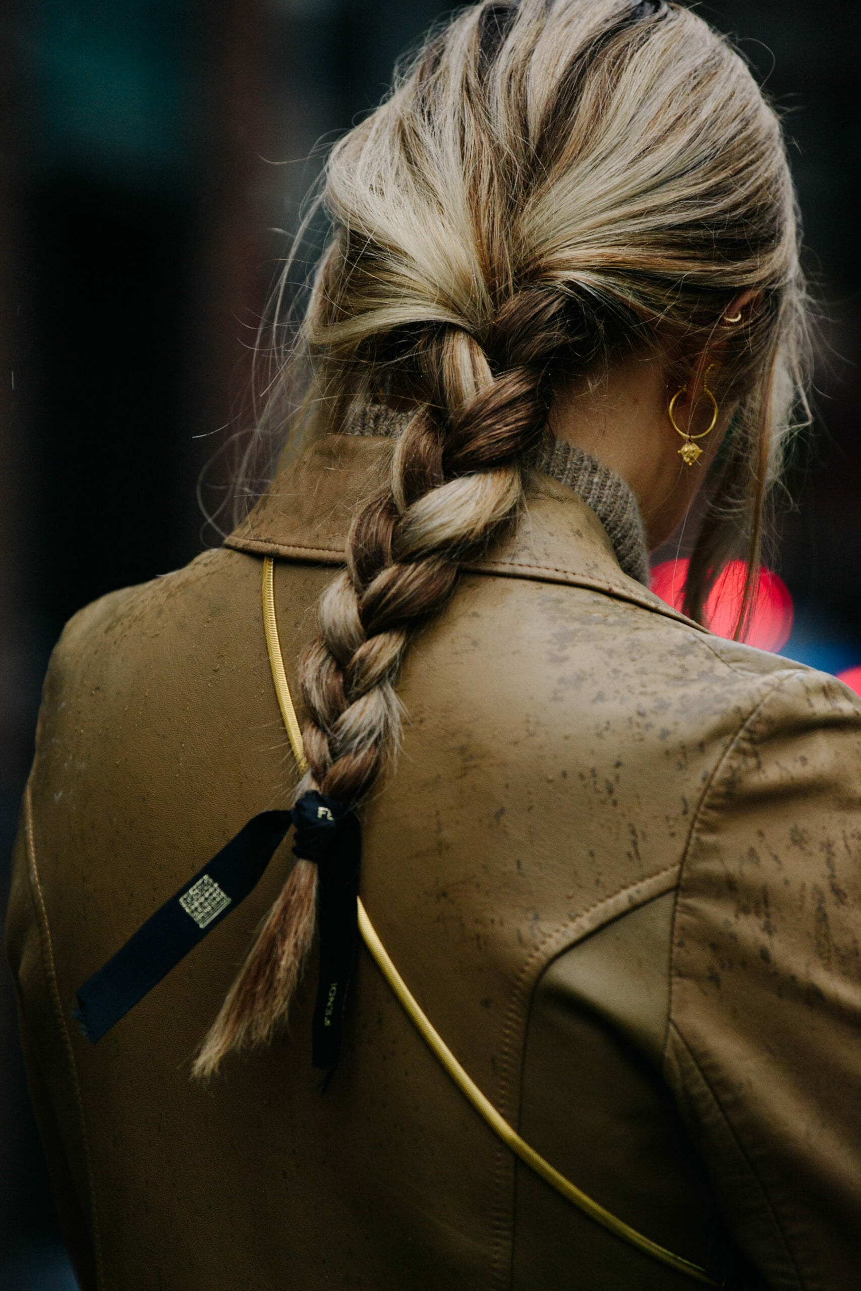 Woman wearing tan coat