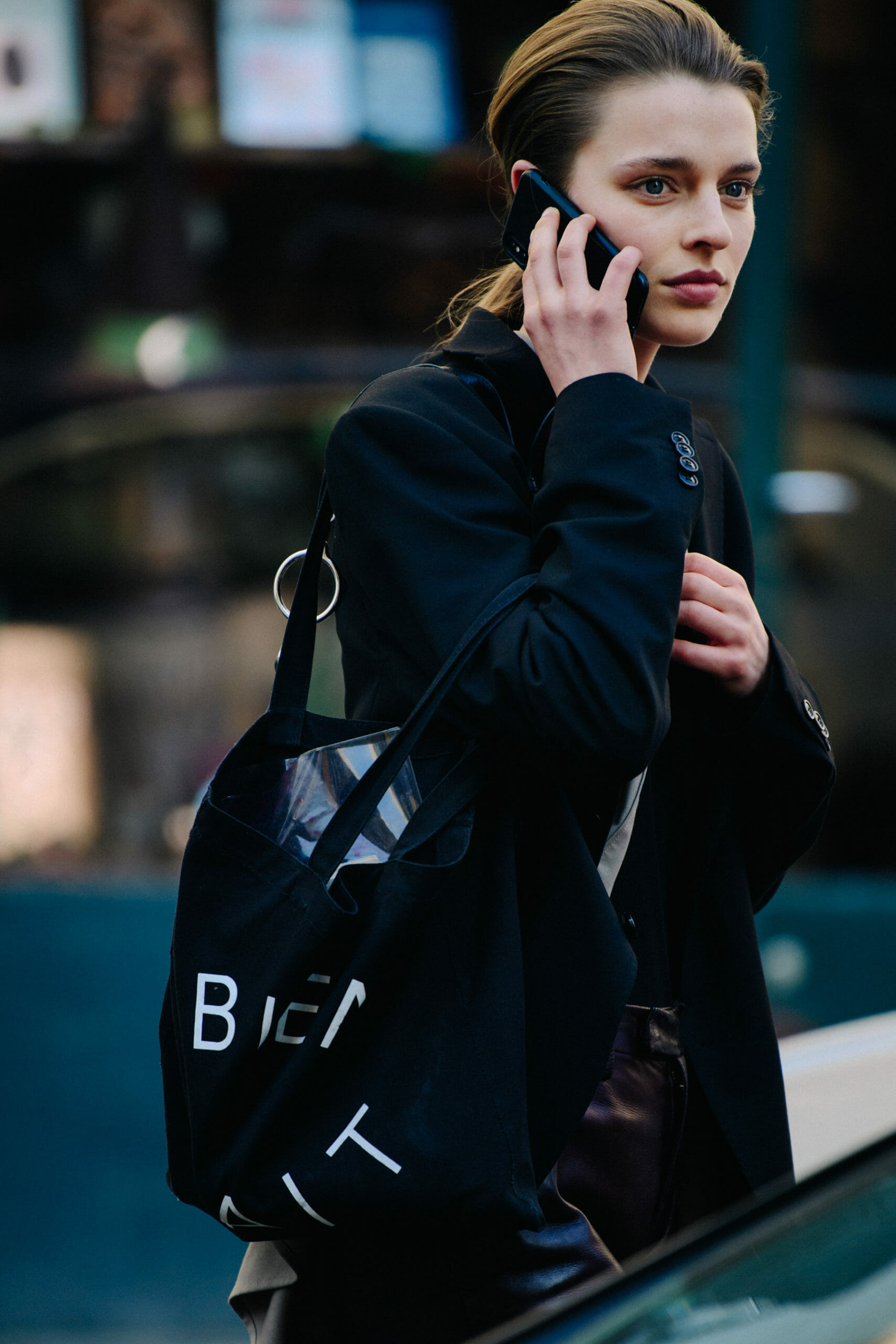 Woman carrying black bag