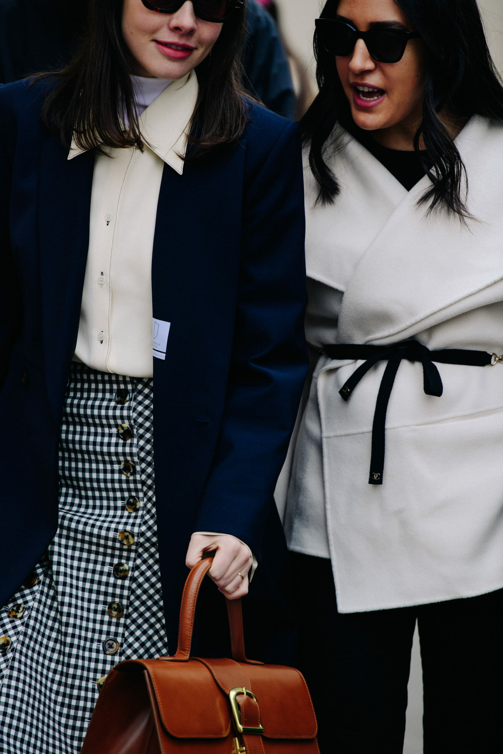 Two women wearing light wool