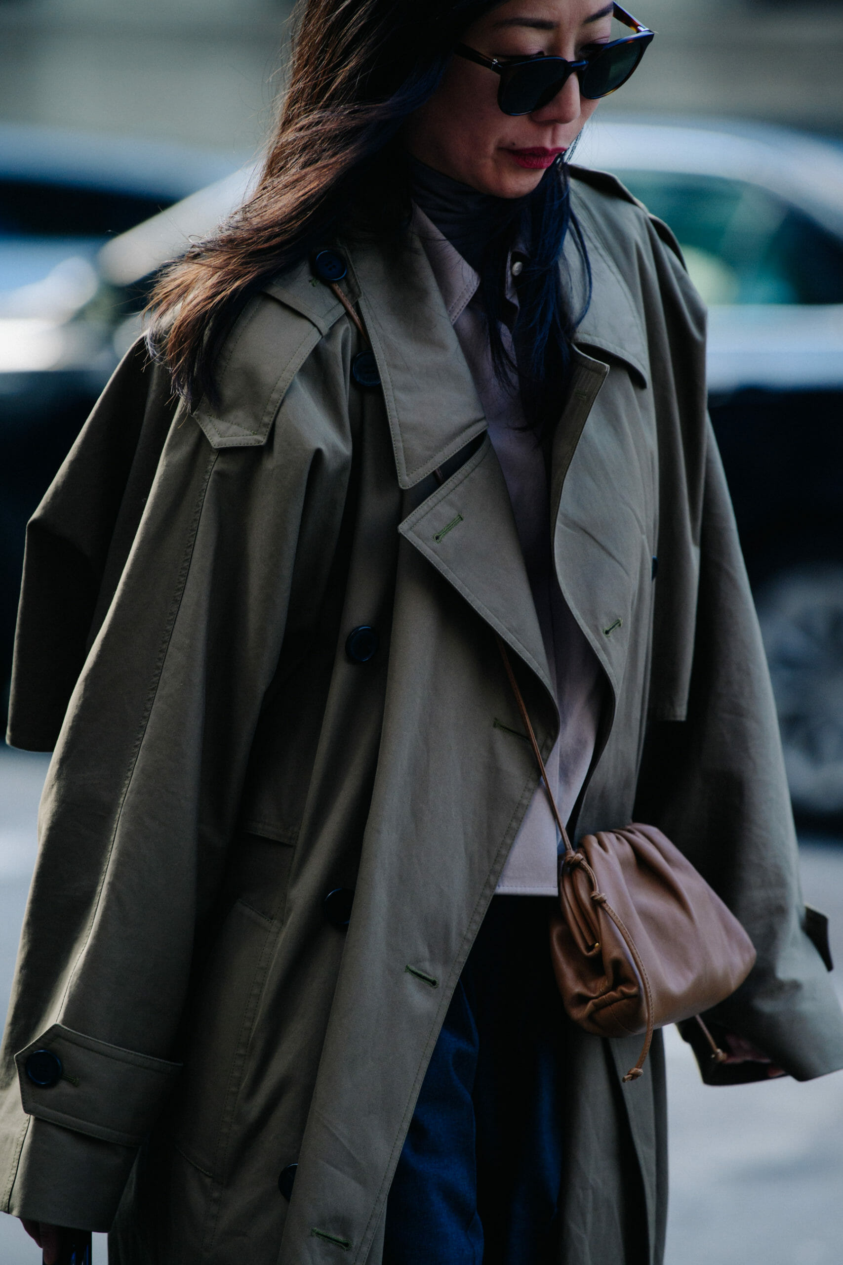 Woman wearing grey trench coat