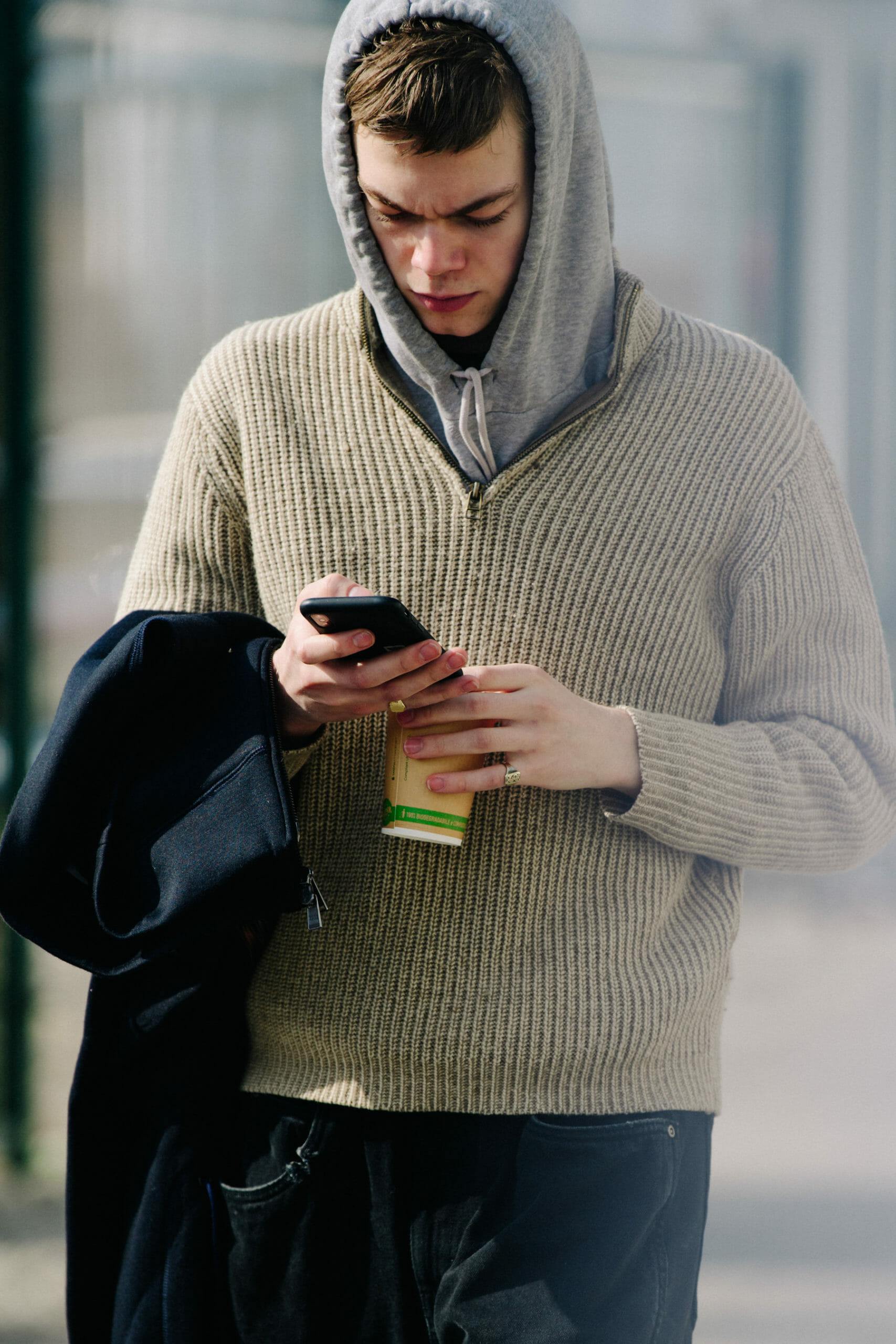 Model wearing grey hoodie