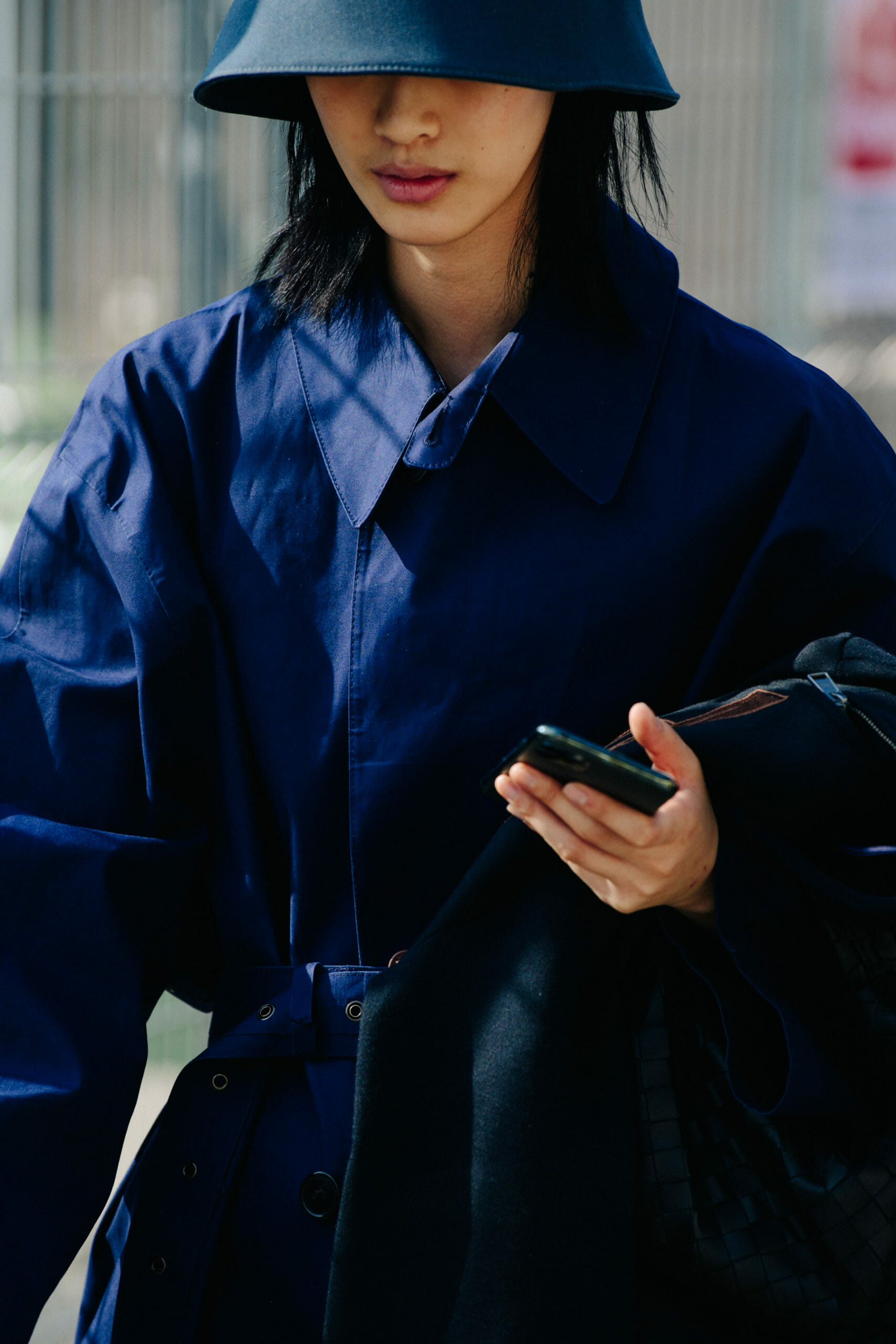 Model wearing large blue hat