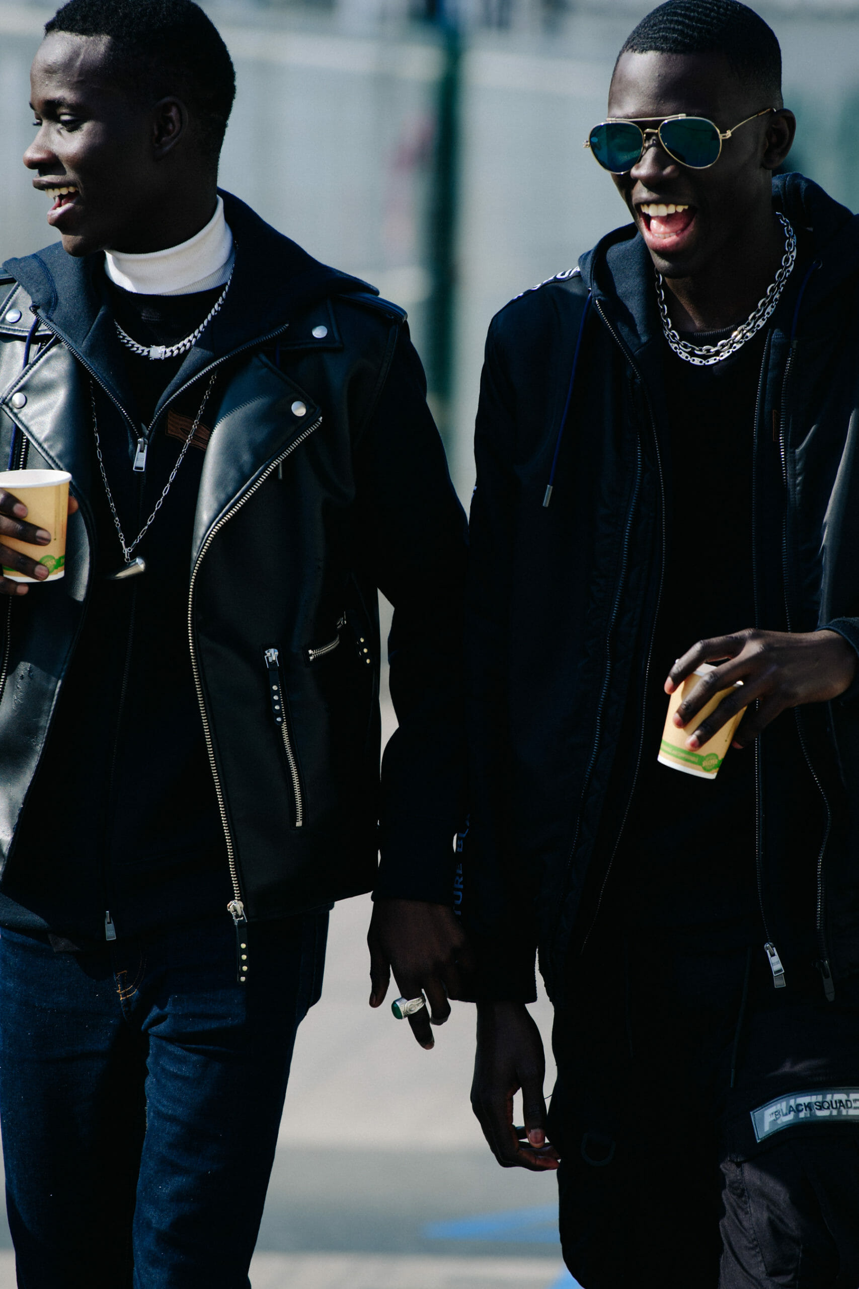 Two models wearing all black