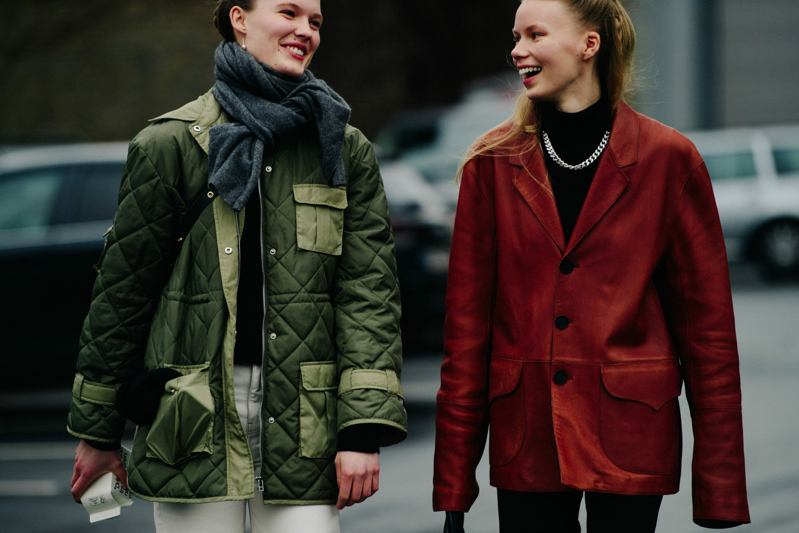 Two models wearing green and brown
