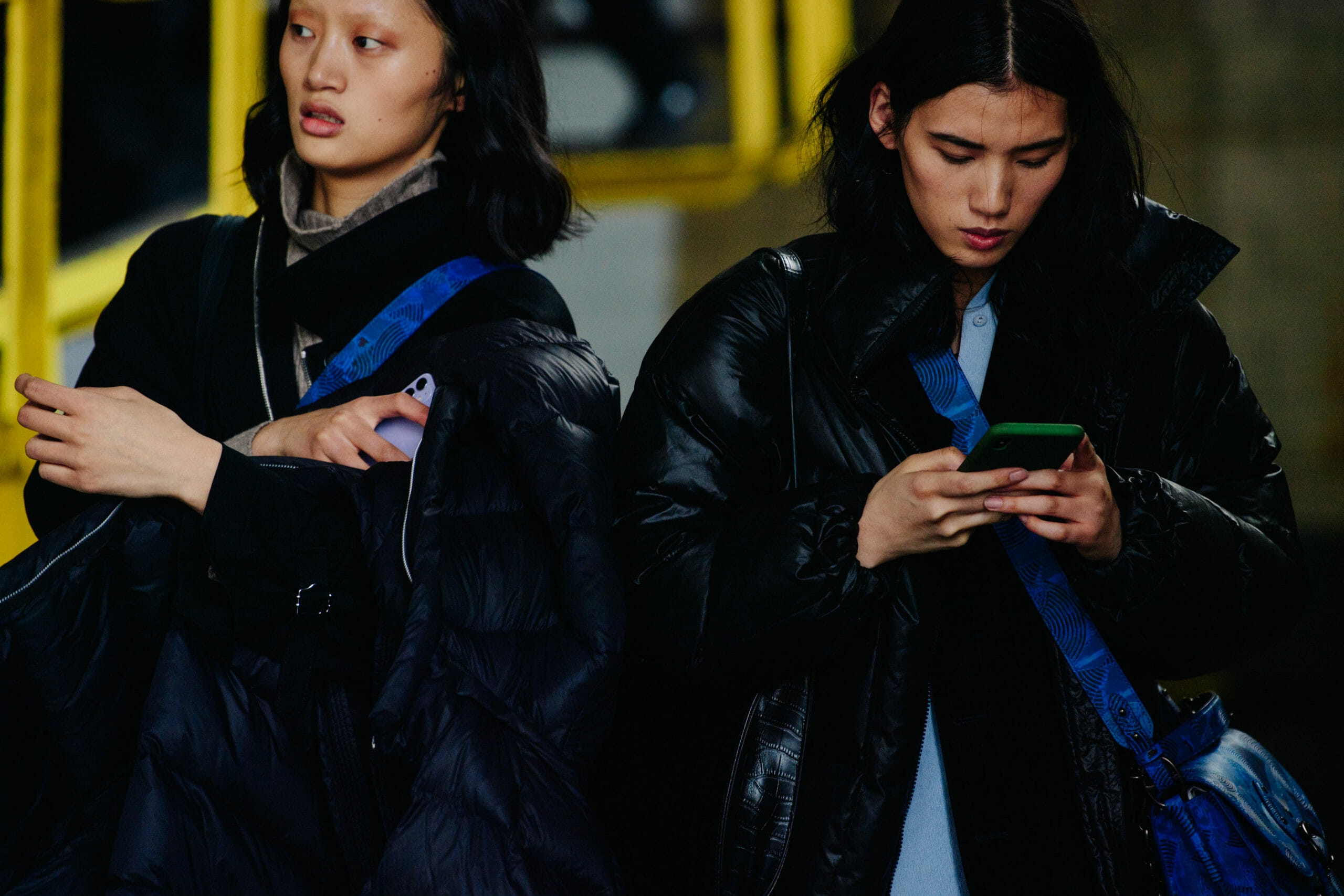 Models wearing black and blue