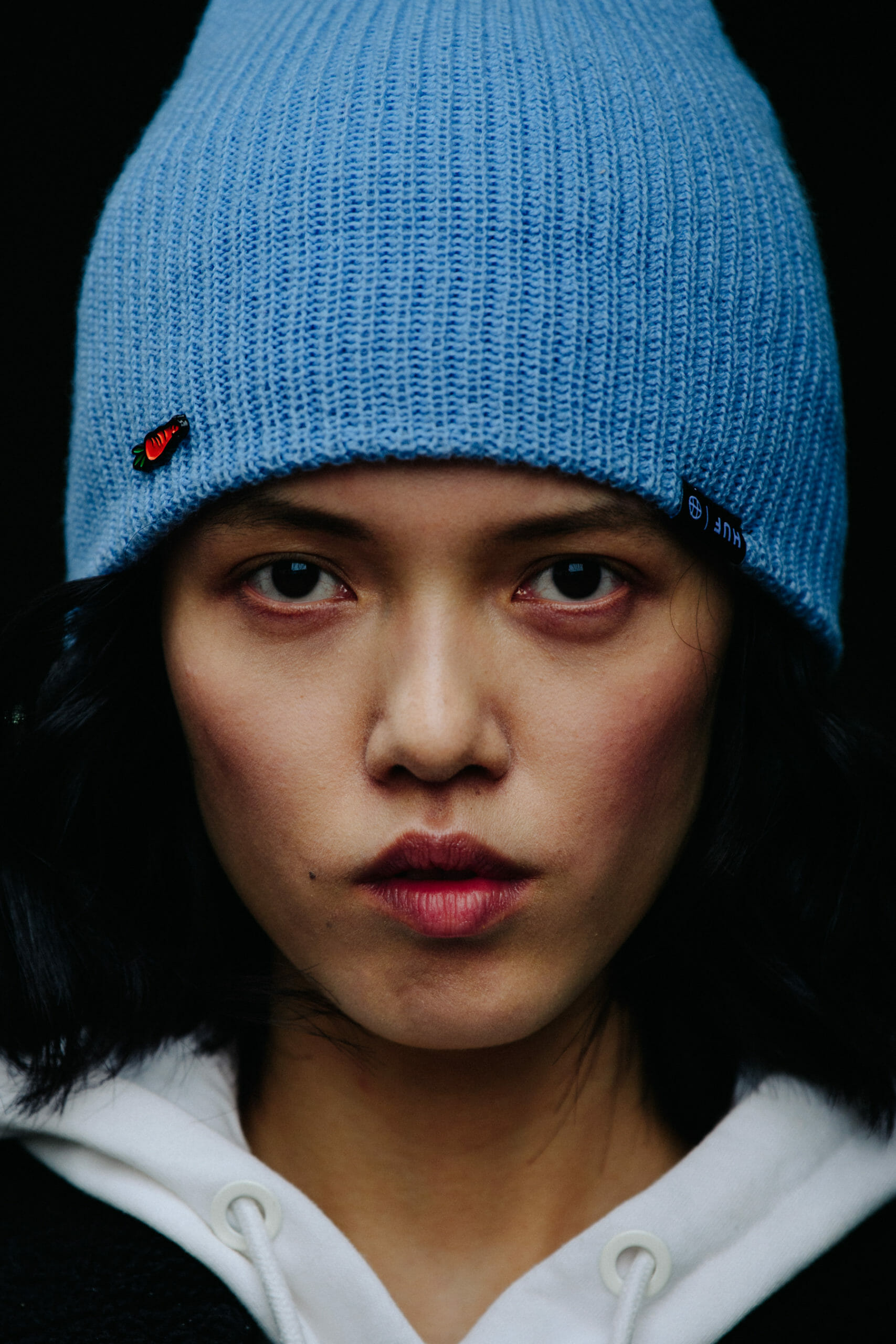 Model wearing HUF beanie