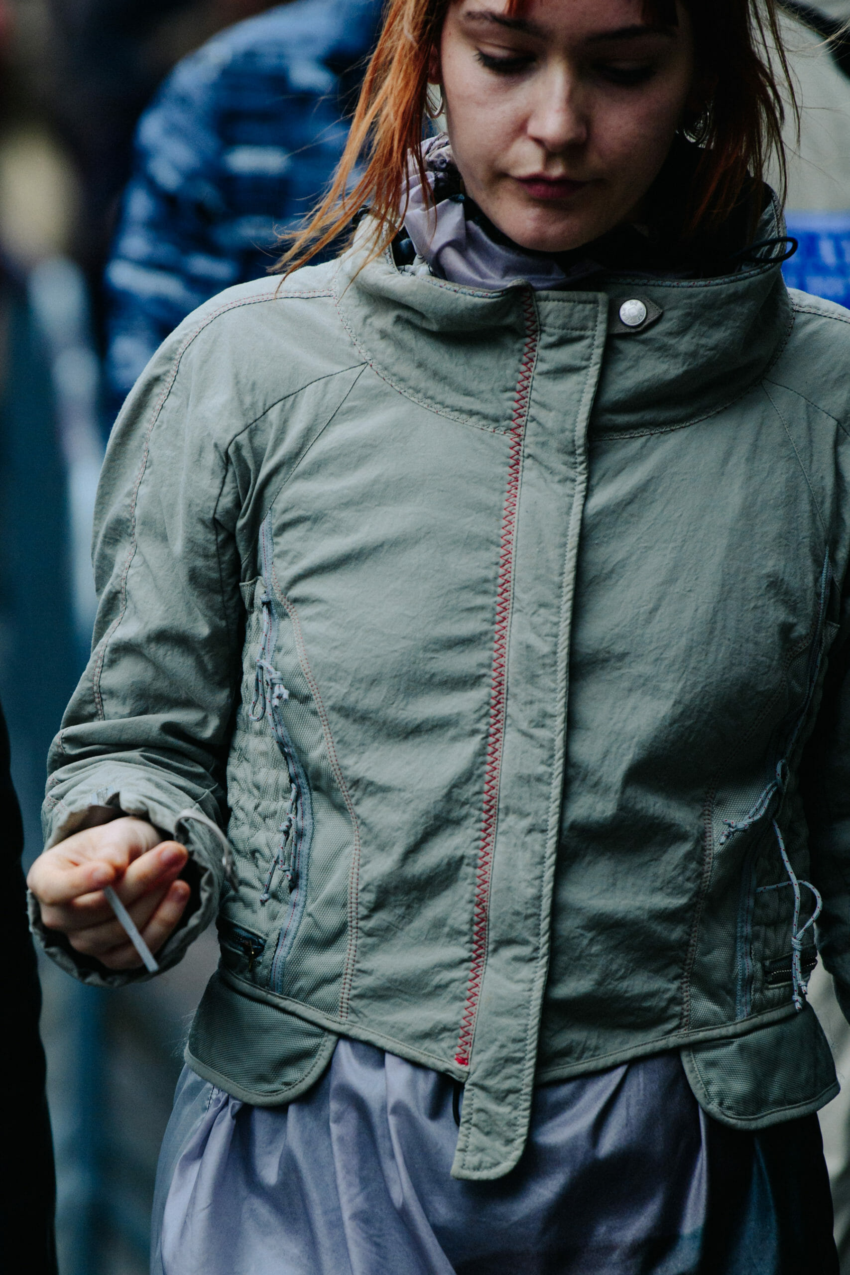 Woman wearing grey jacket