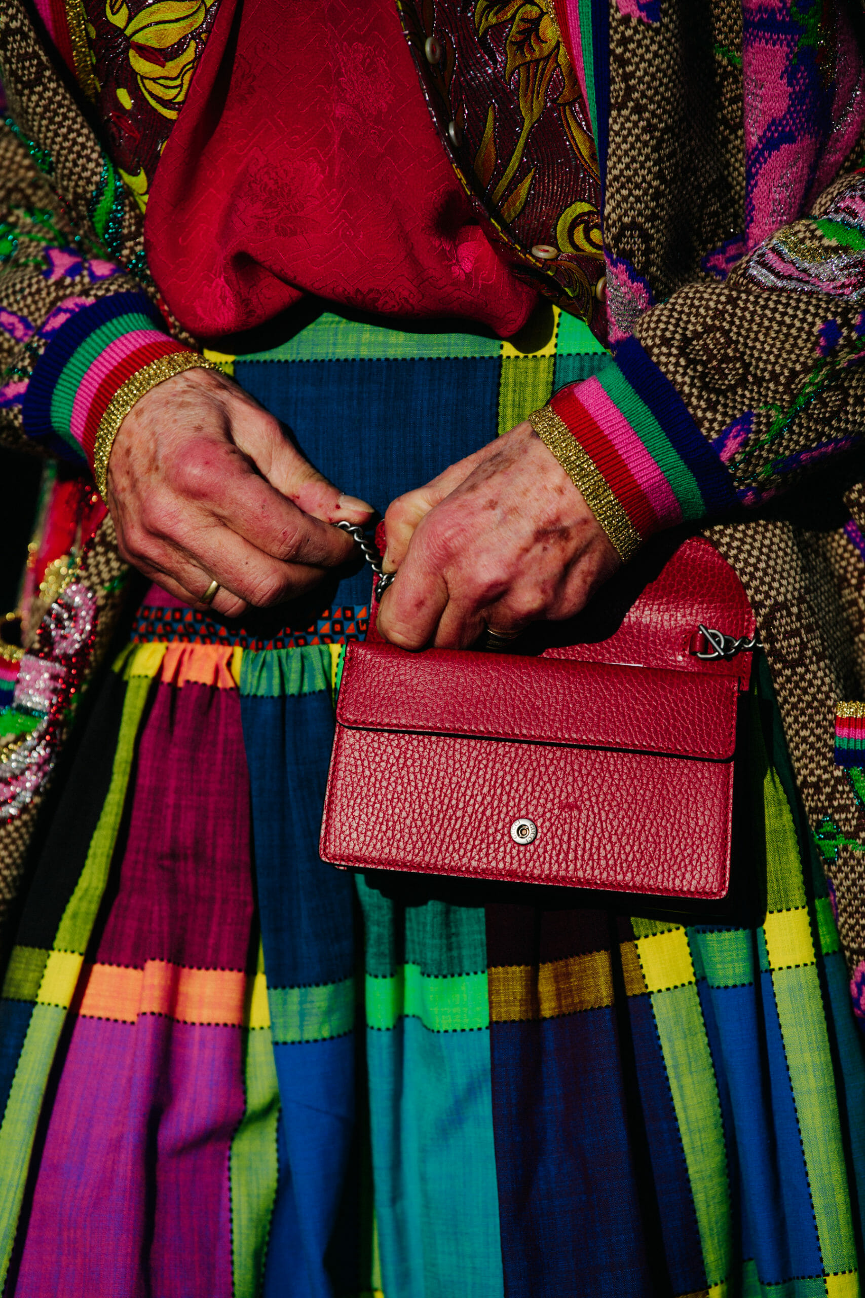 Woman carrying red bag