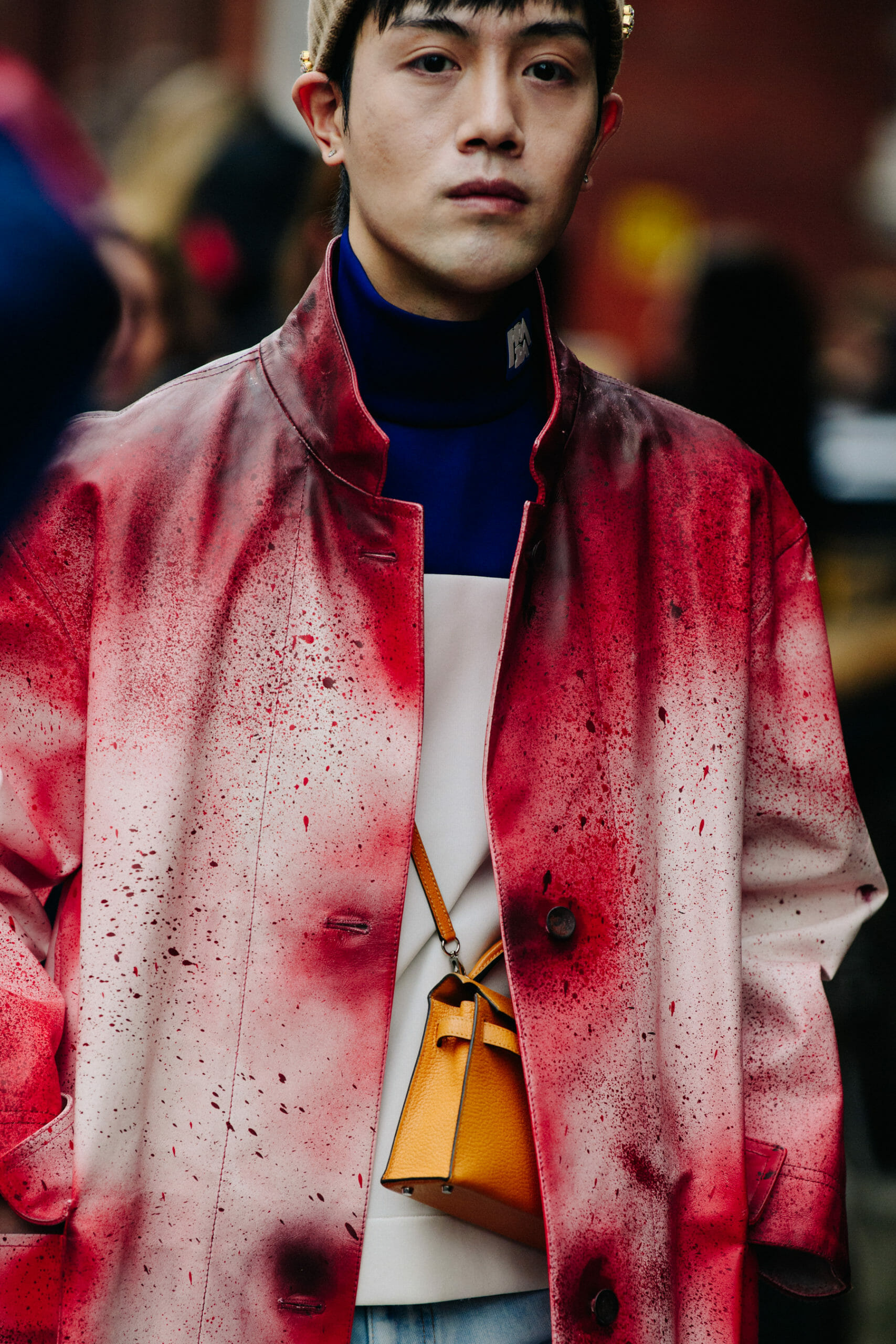 Man wearing red painted coat