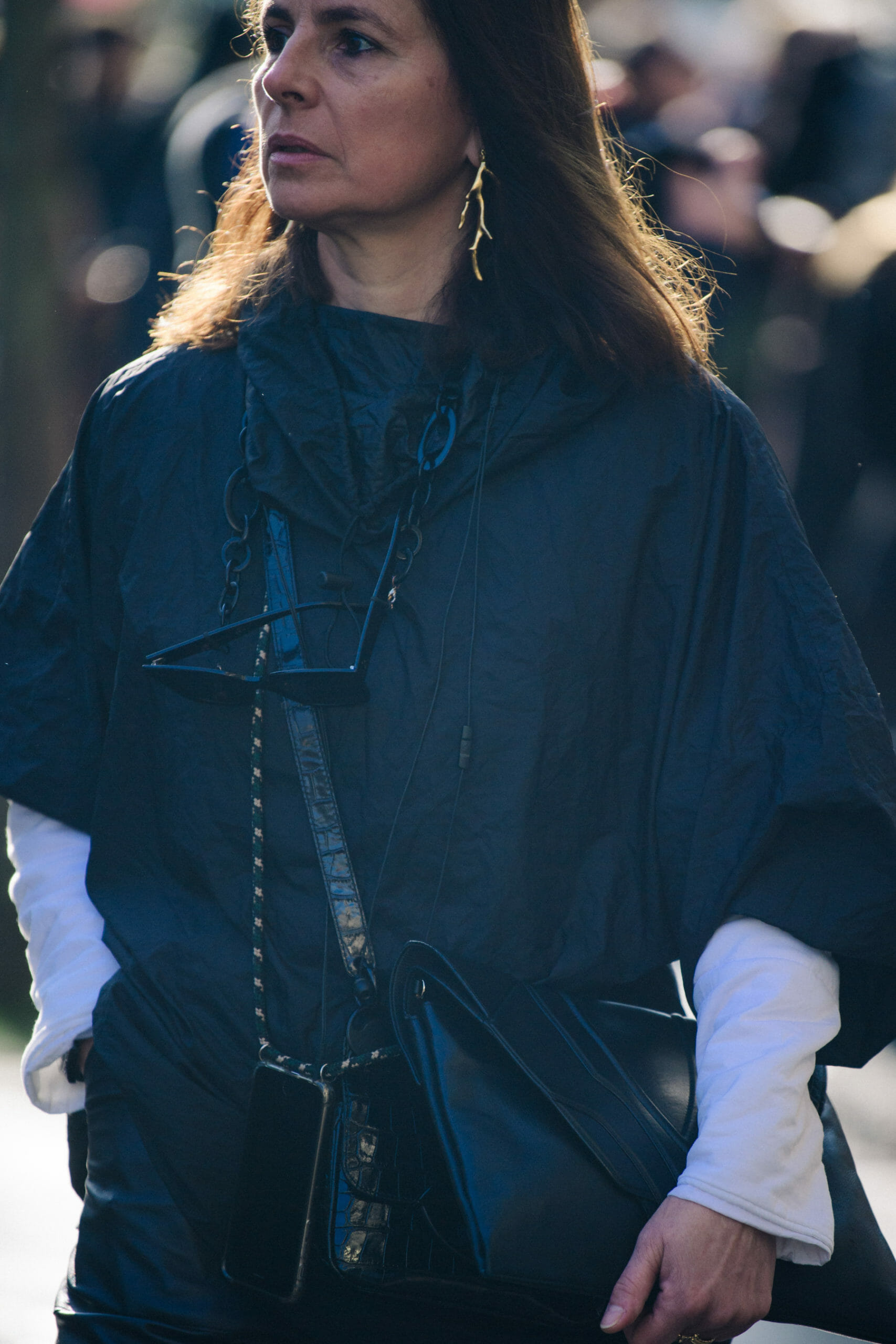 Woman wearing black poncho