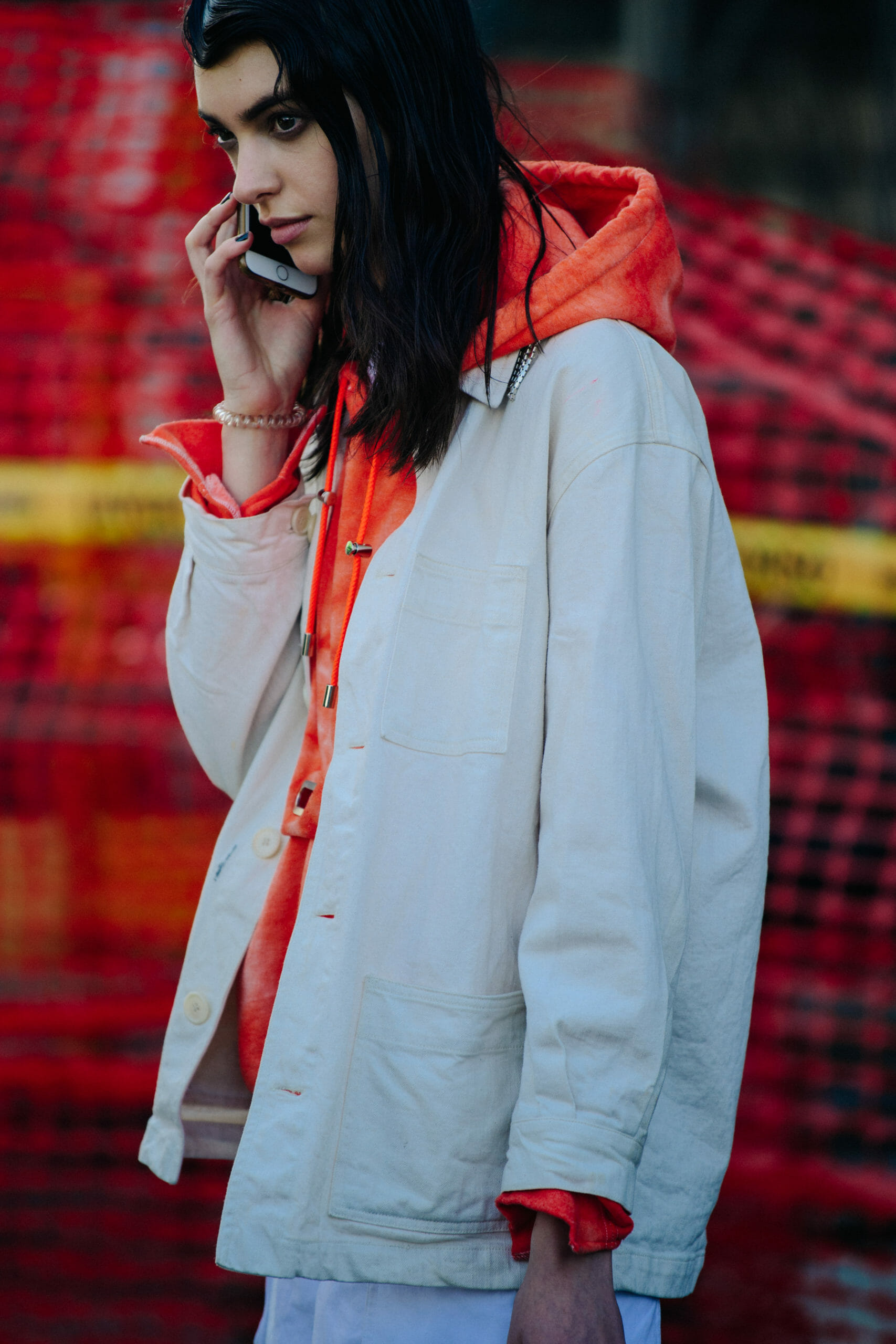 Model wearing orange hoodie