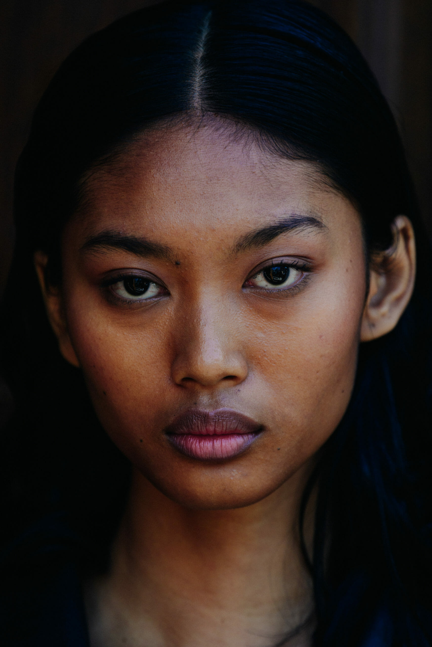Model with dark hair and eyes
