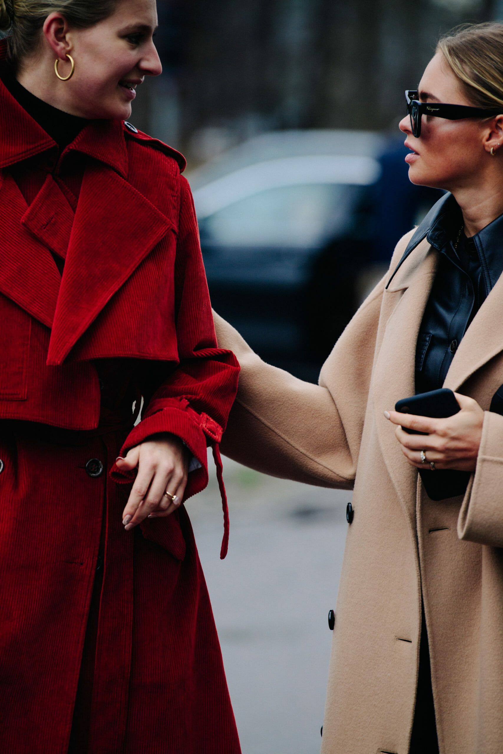 Two women wearing winter coats