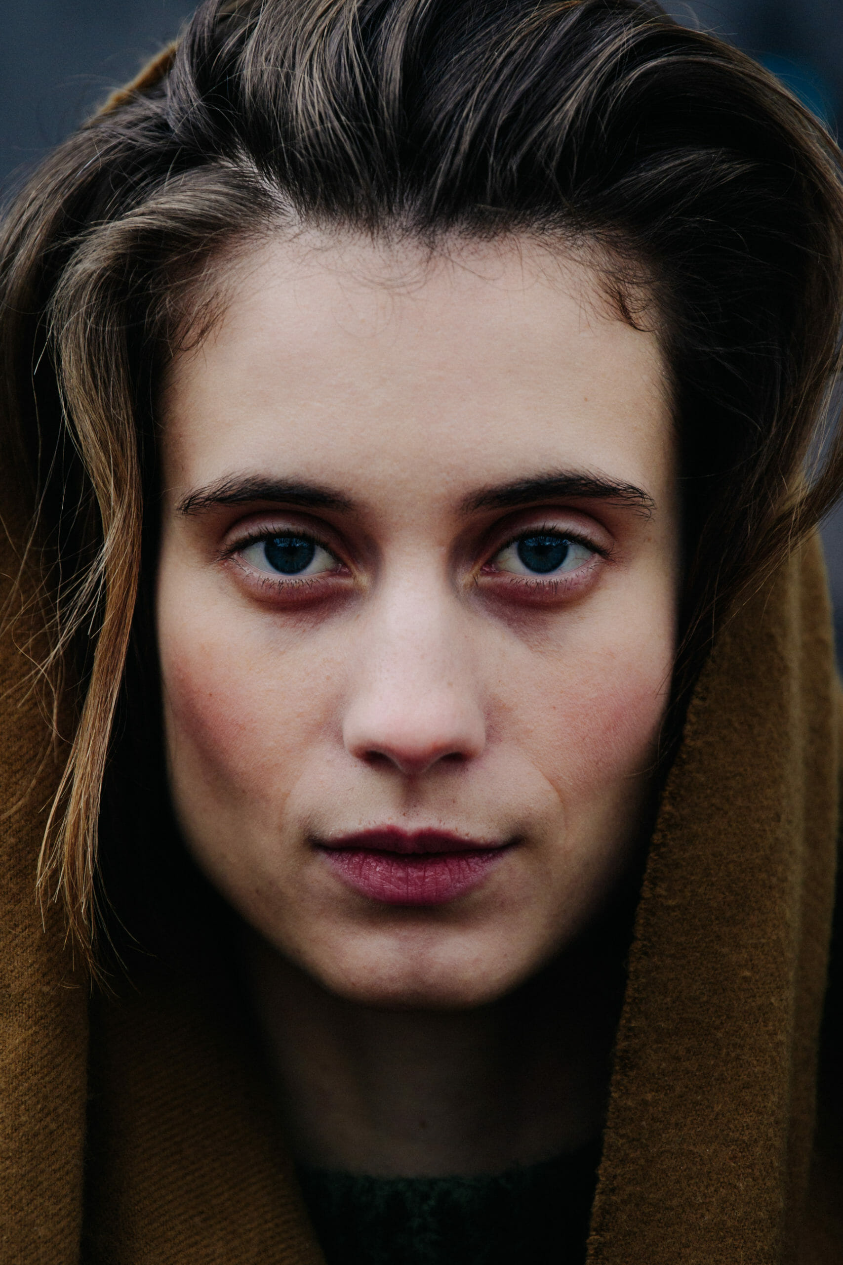 Model wearing brown scarf