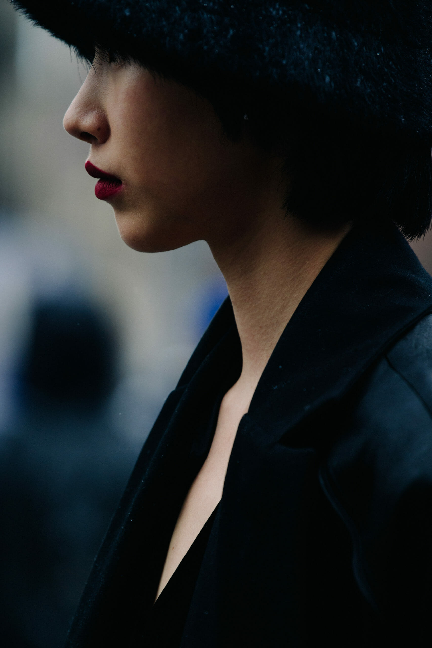 Woman wearing black fur hat