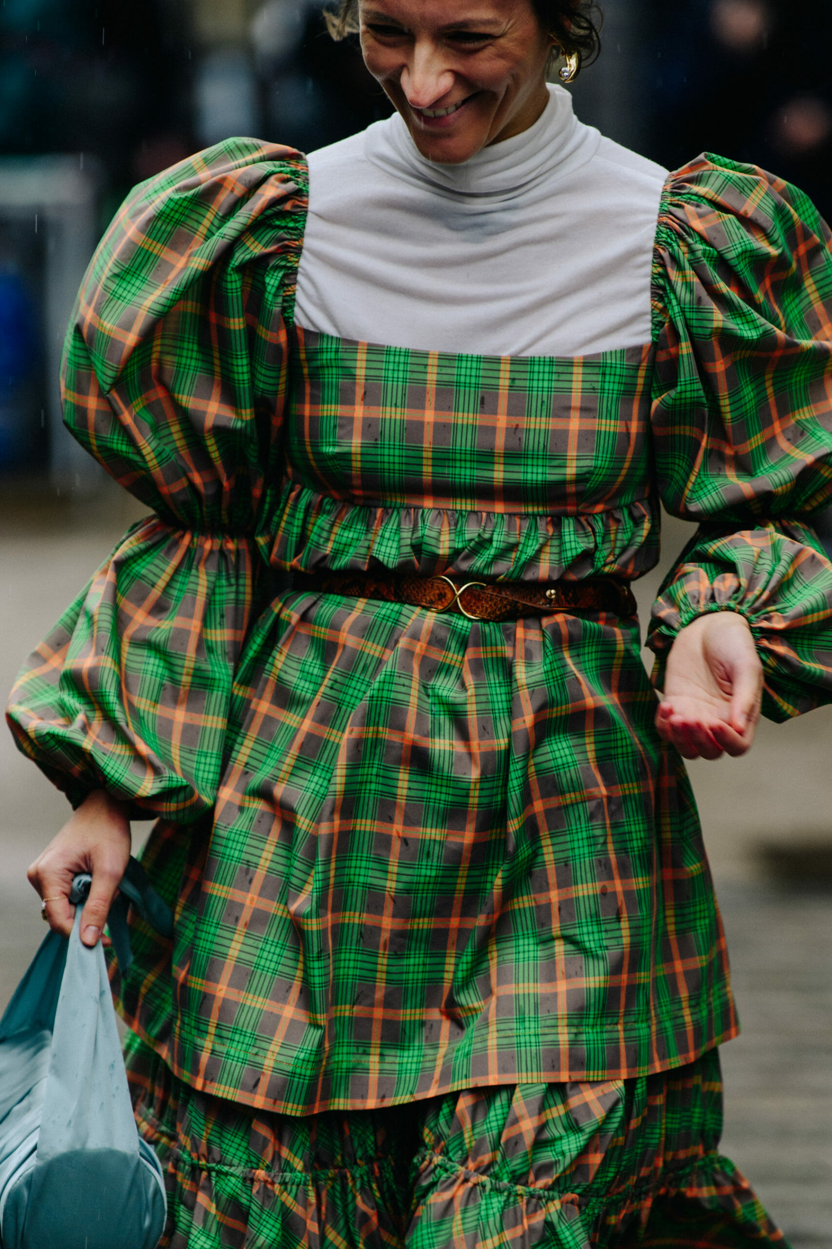 Woman wearing green check dress