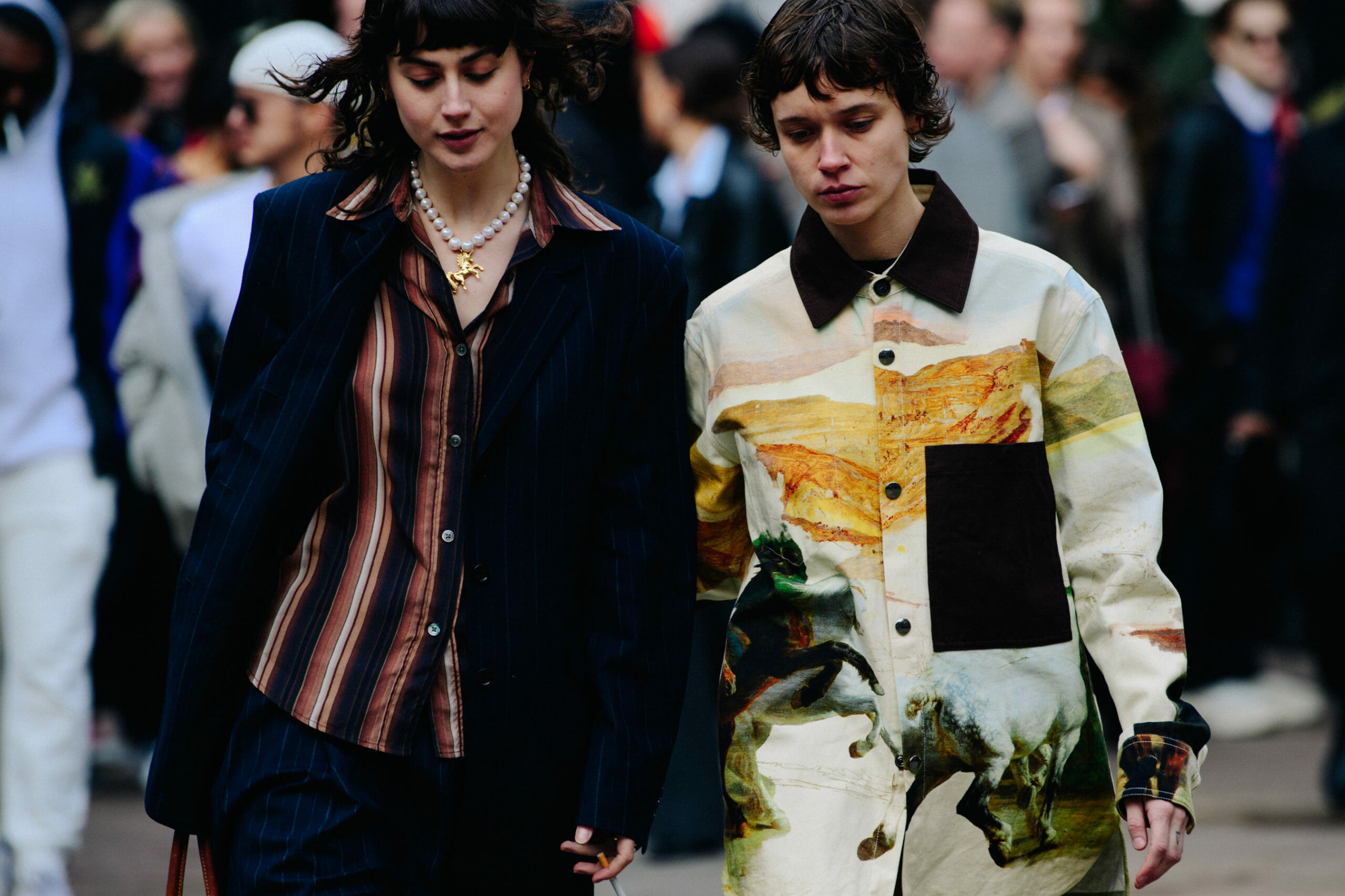 Two women wearing pattern shirts