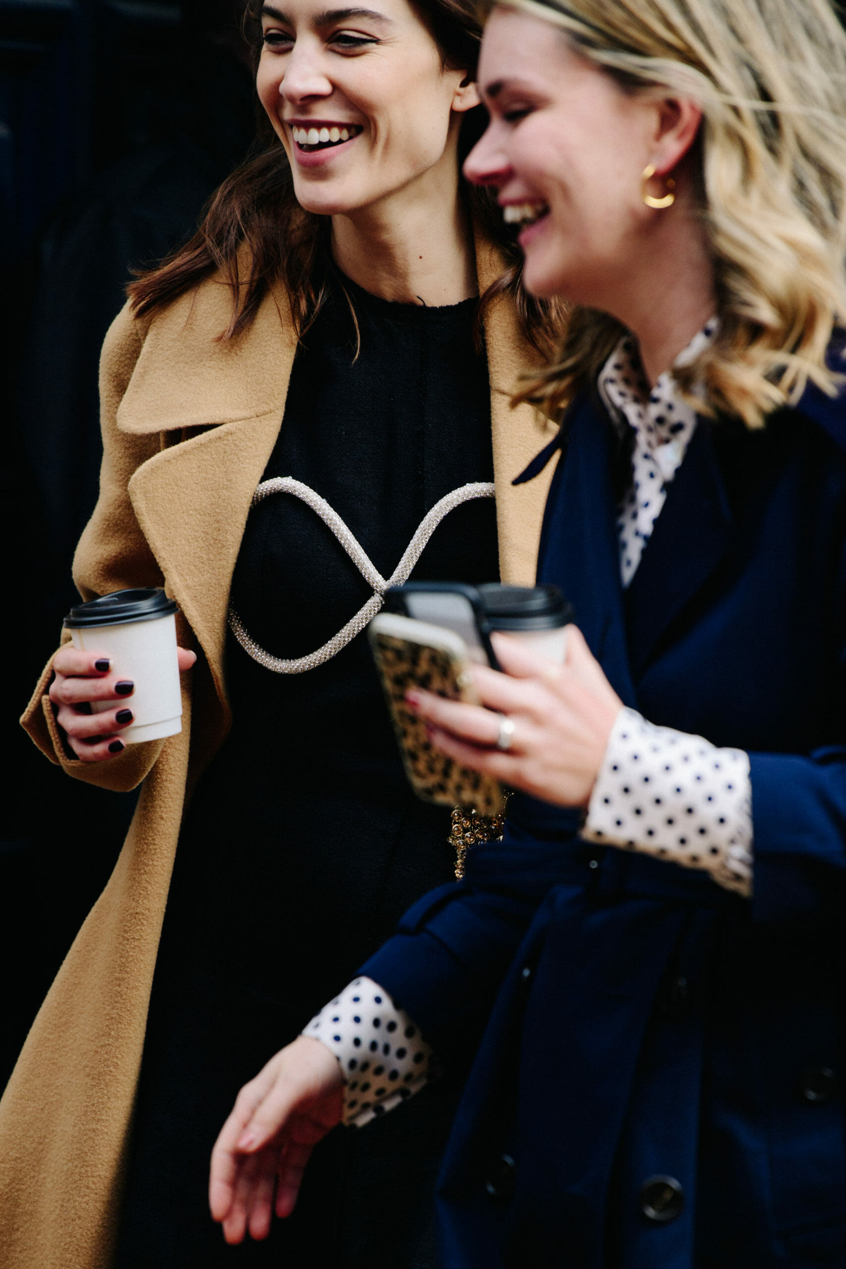 Woman wearing tan coat