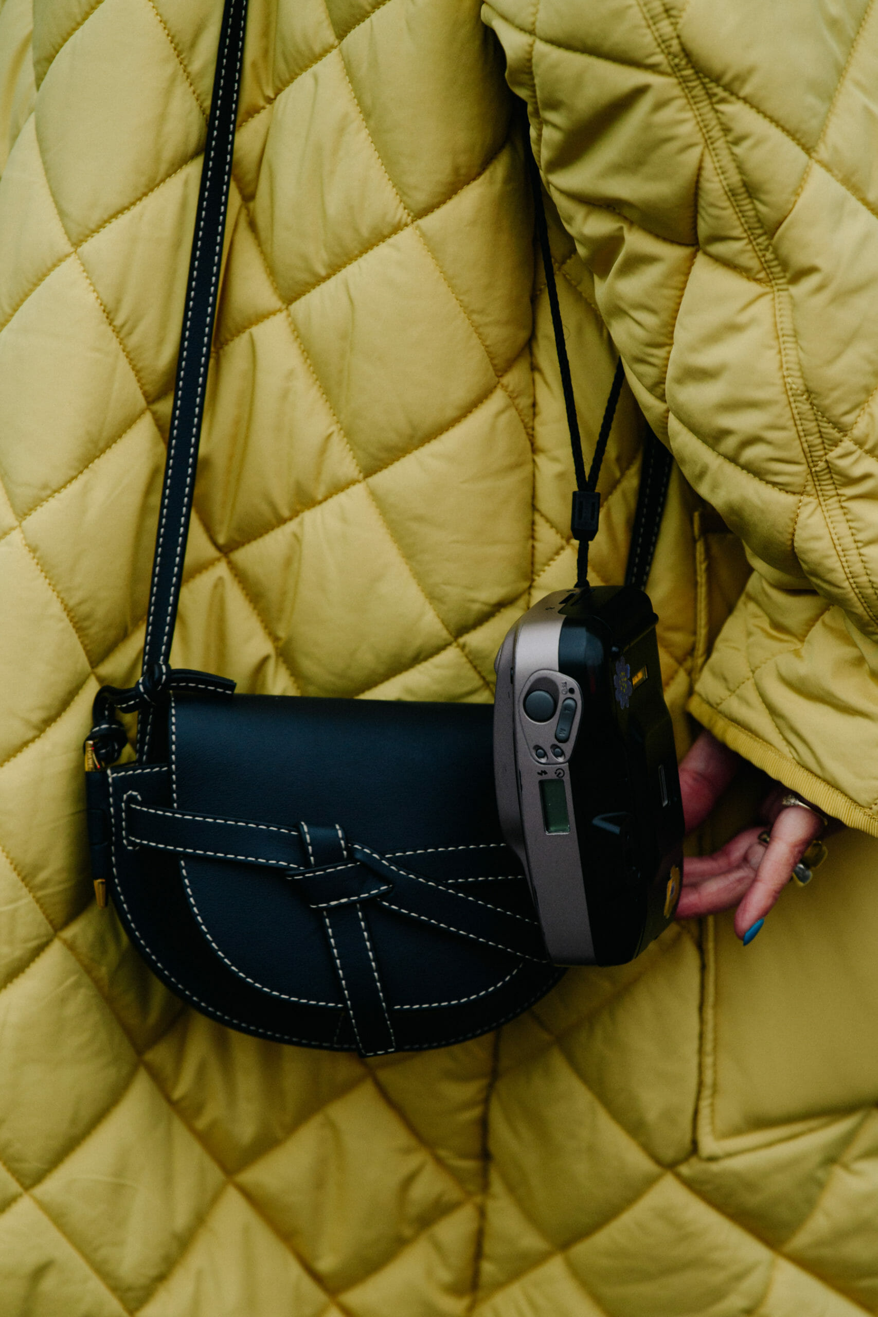 Woman carrying film camera