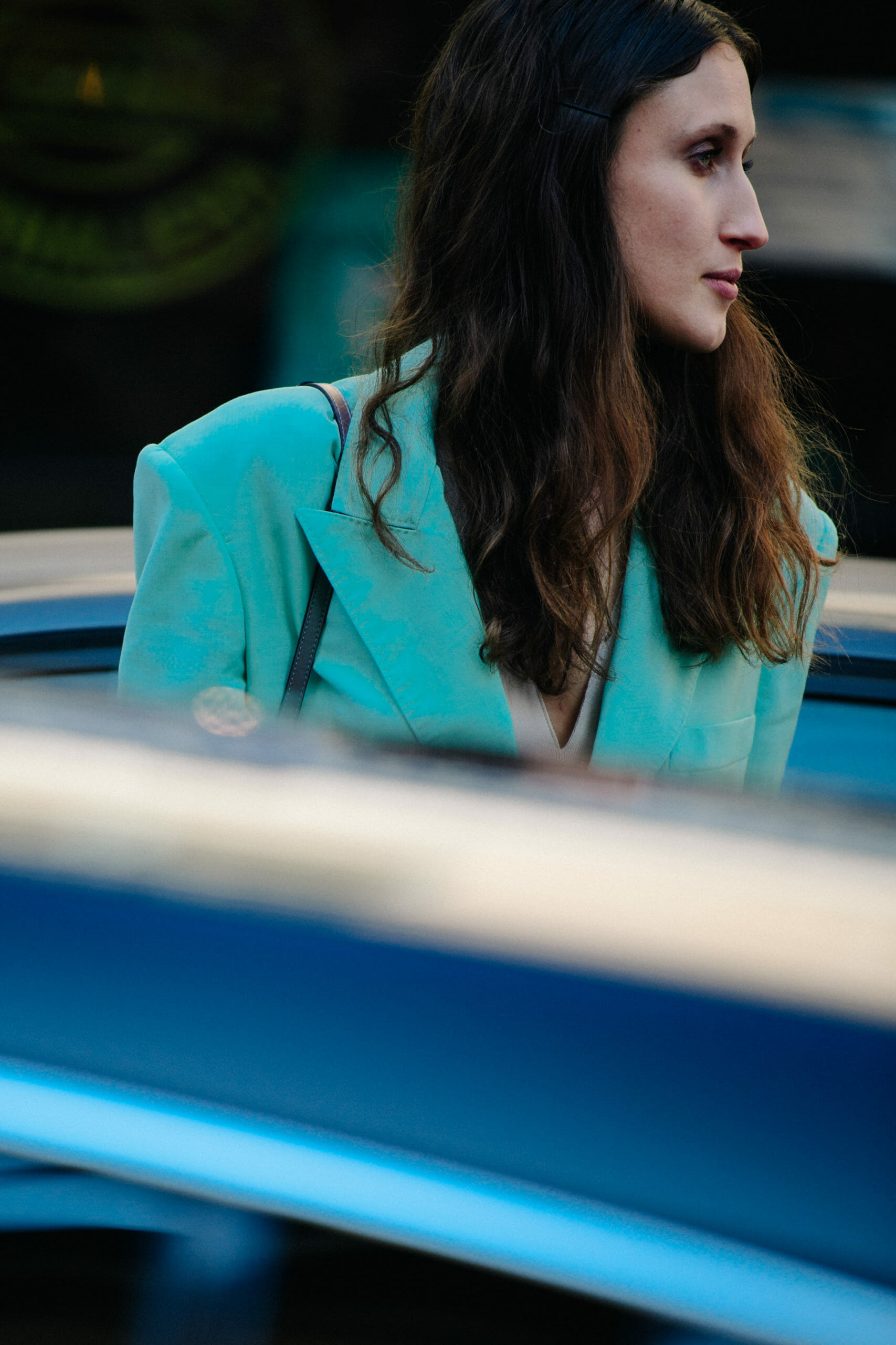 Model wearing teal suit