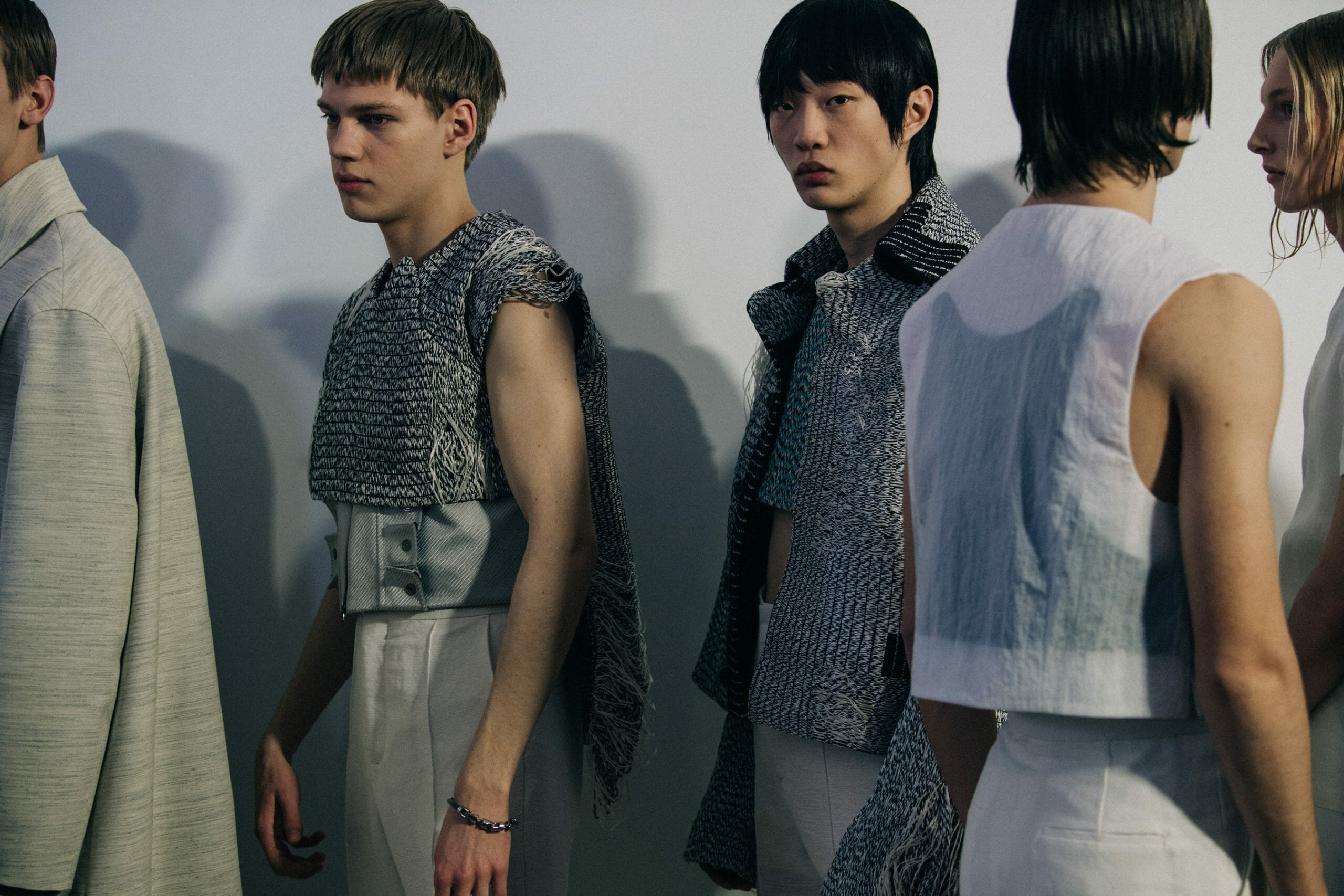 Models wearing light outfits
