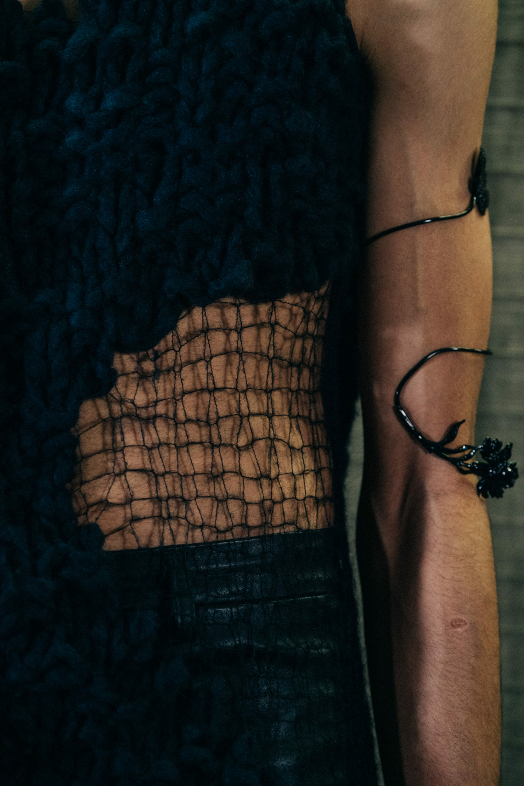 Model wearing black leaves at Ann Demeulemeester