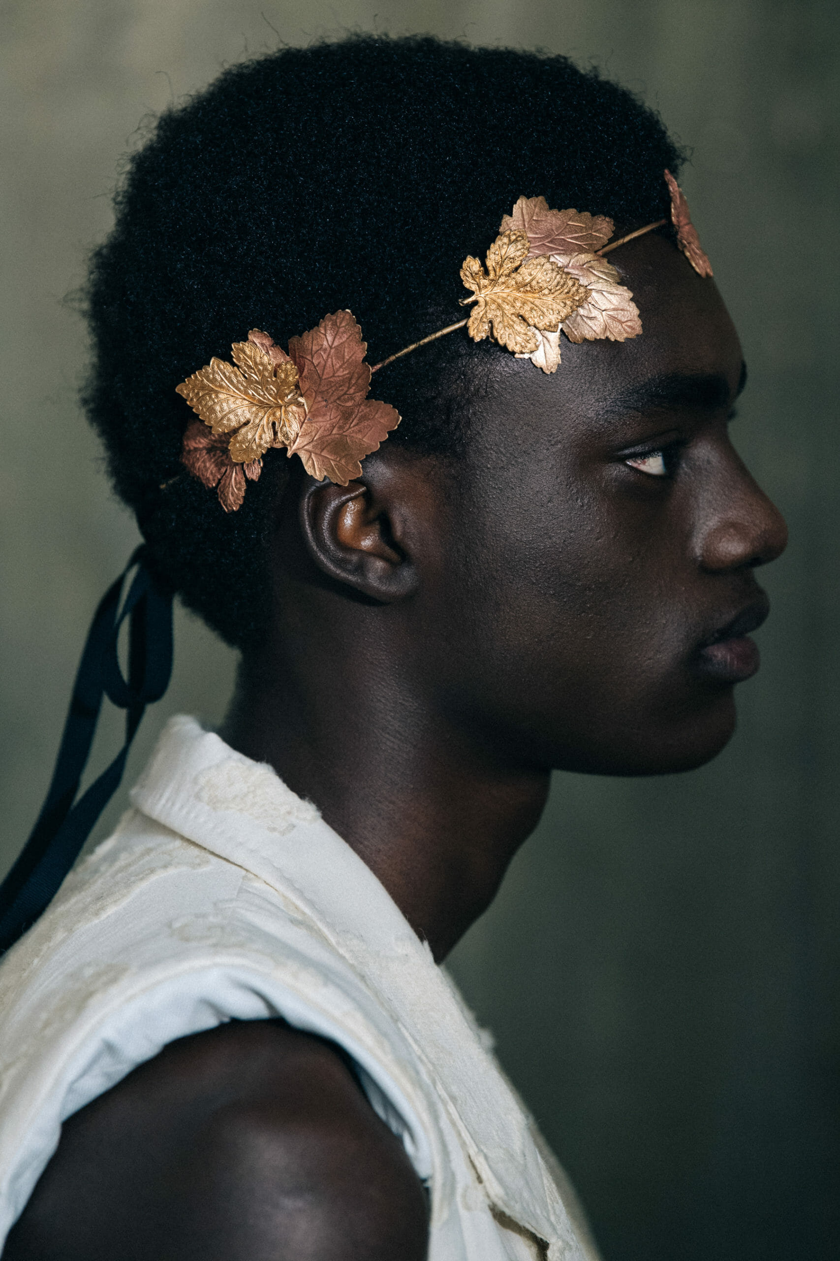 Models wearing gold leaves at Ann Demeulemeester