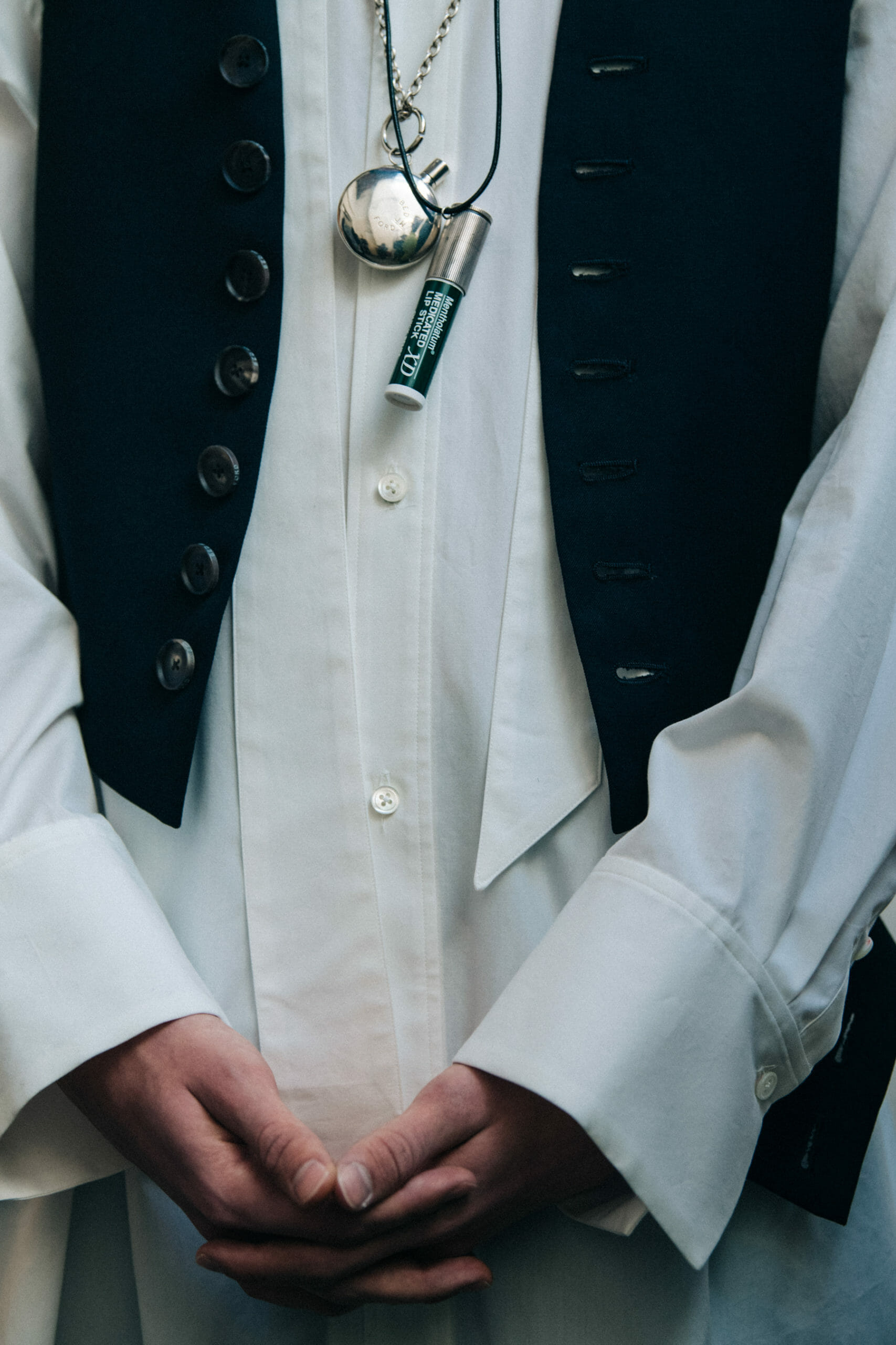 Model wearing chapstick necklace