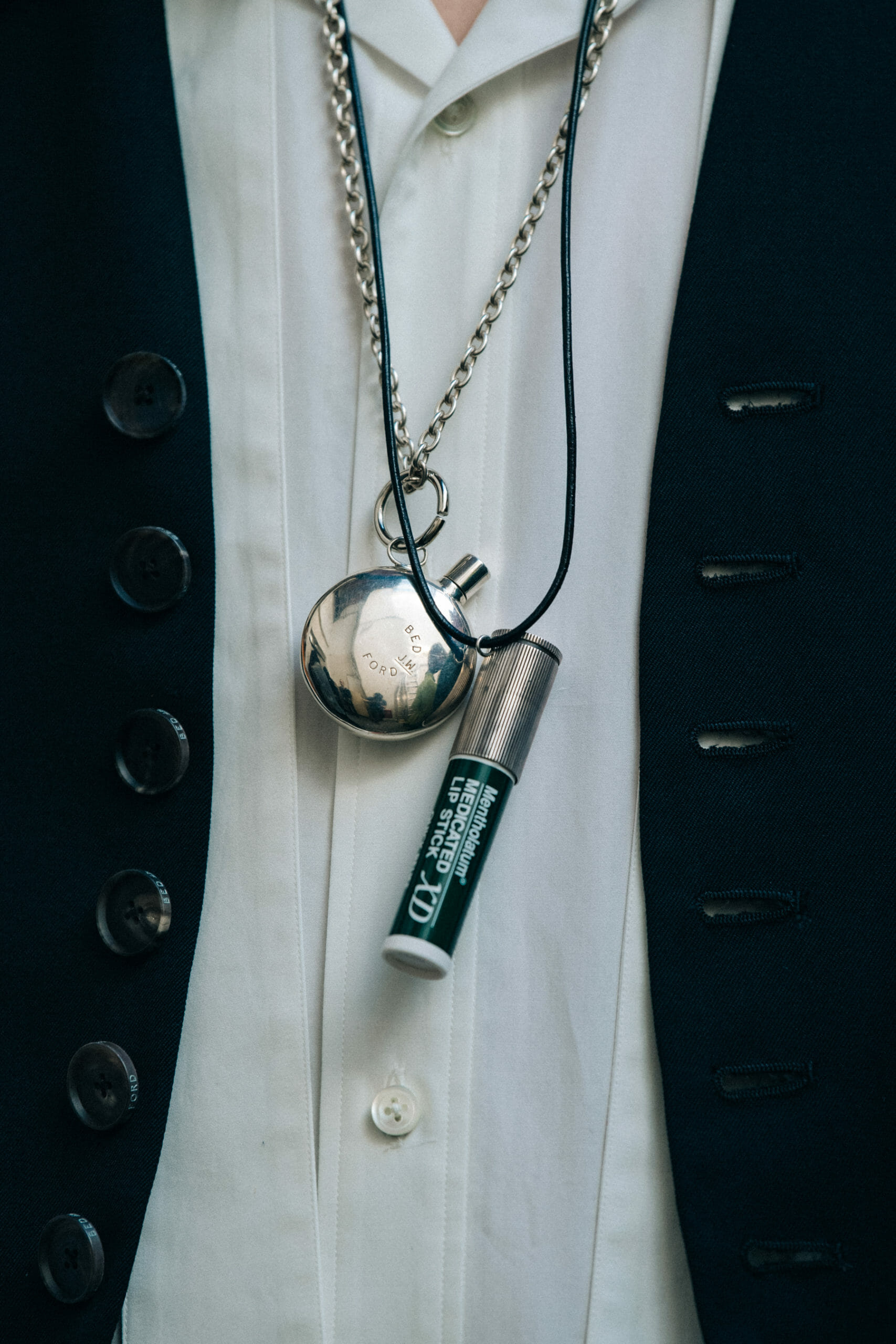 Model wearing chapstick necklace