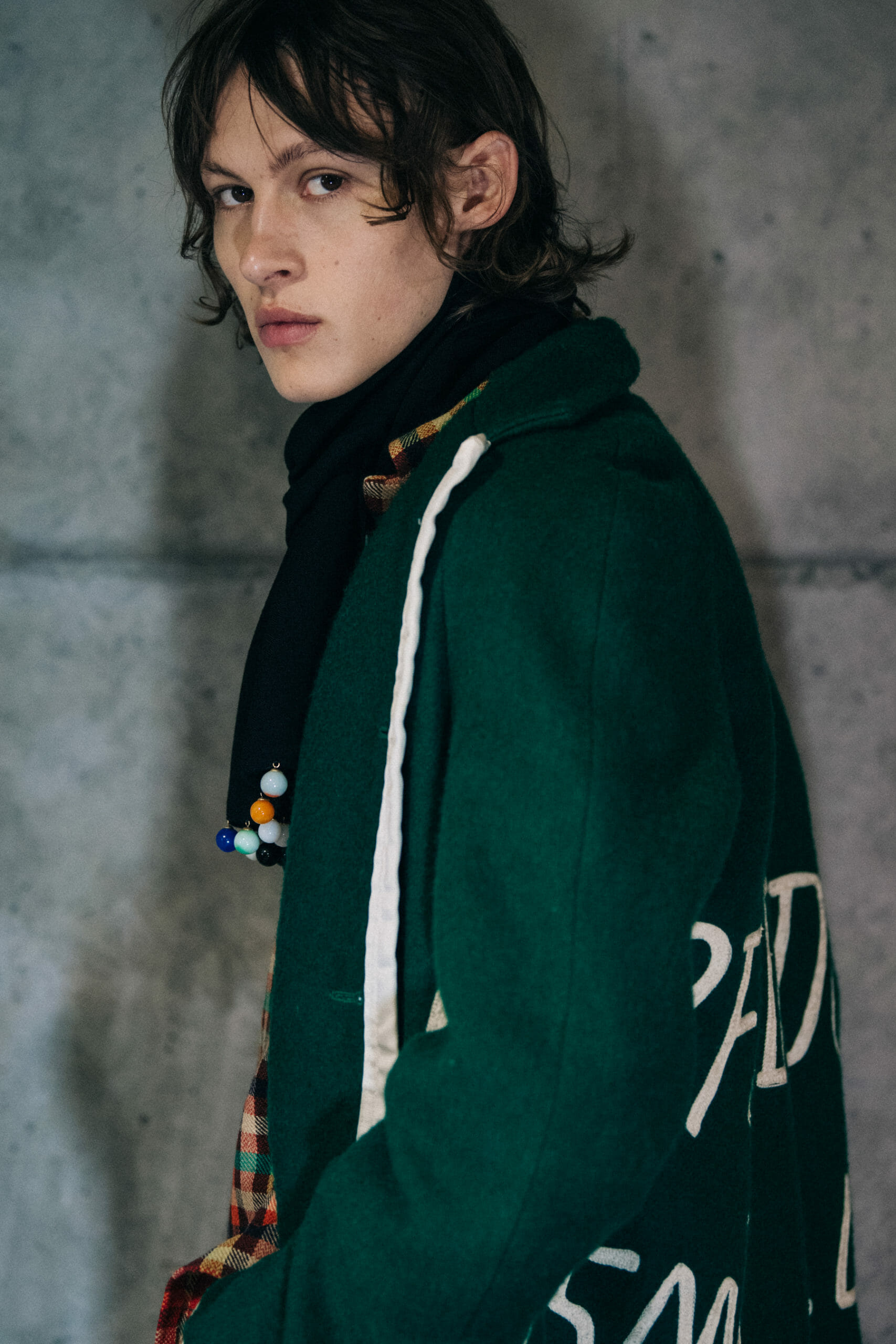 Model wearing green Bode coat