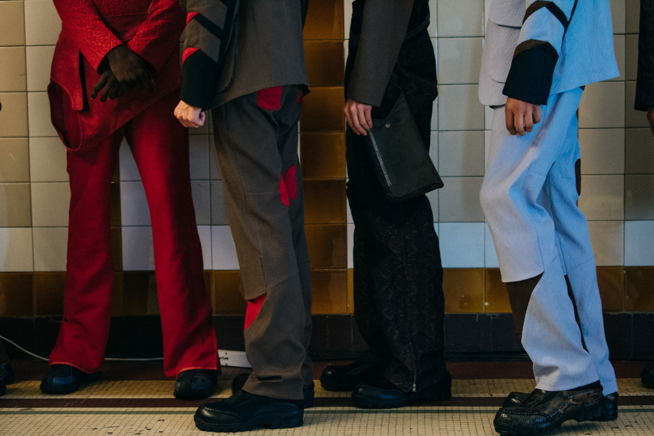 Models wearing red Kiko Kostadinov outfits