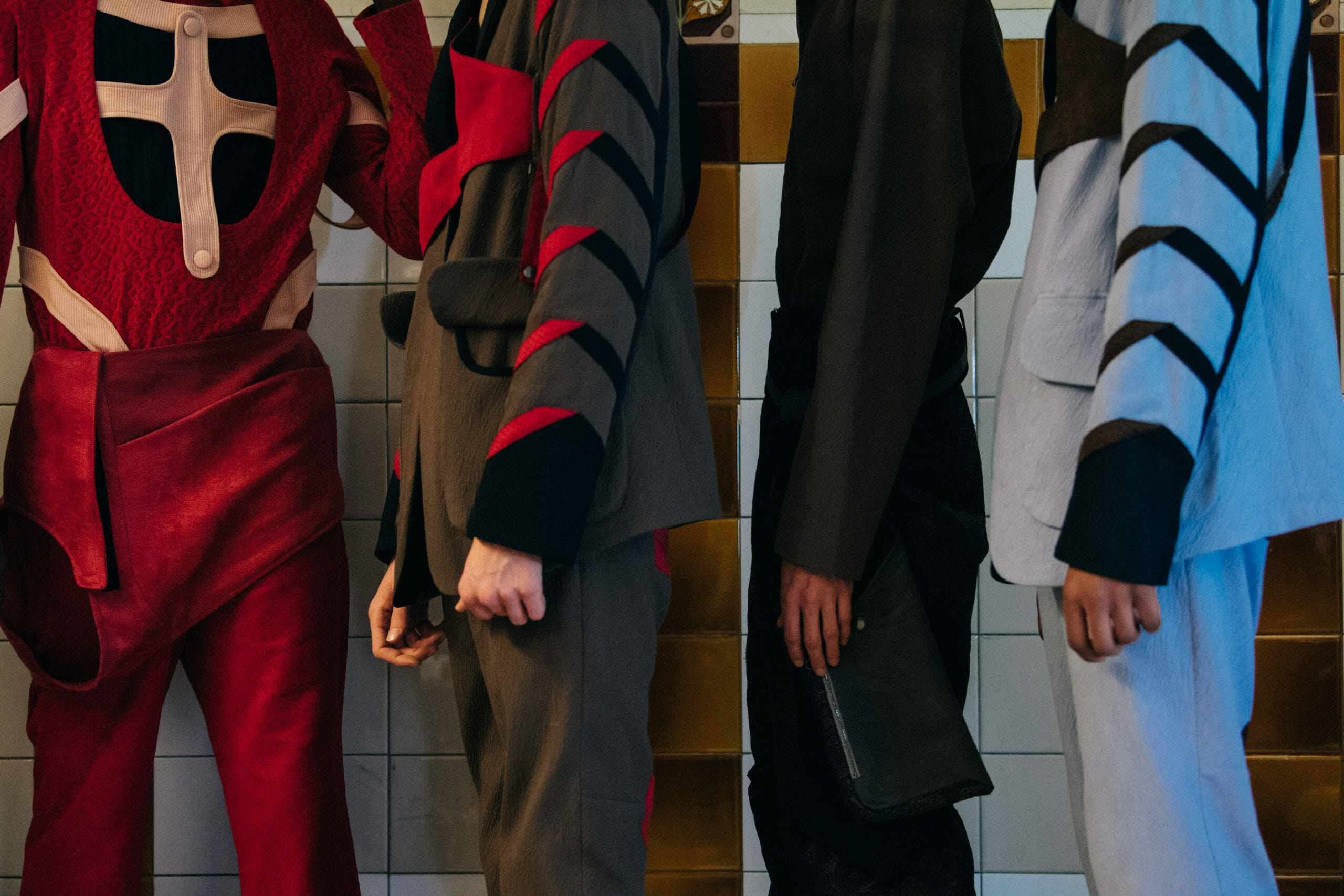 Models wearing red Kiko Kostadinov outfits