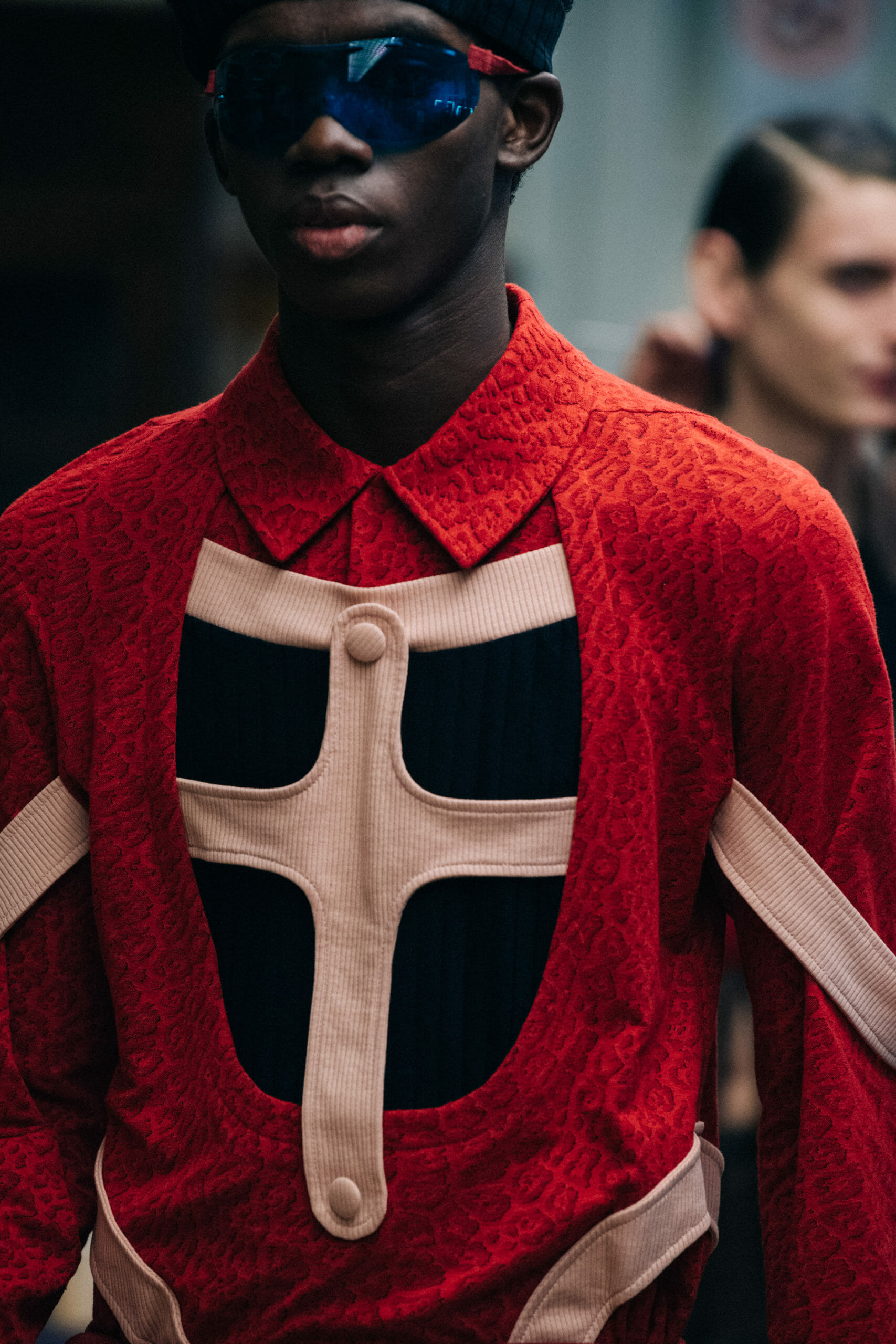 Models wearing red Kiko Kostadinov outfits