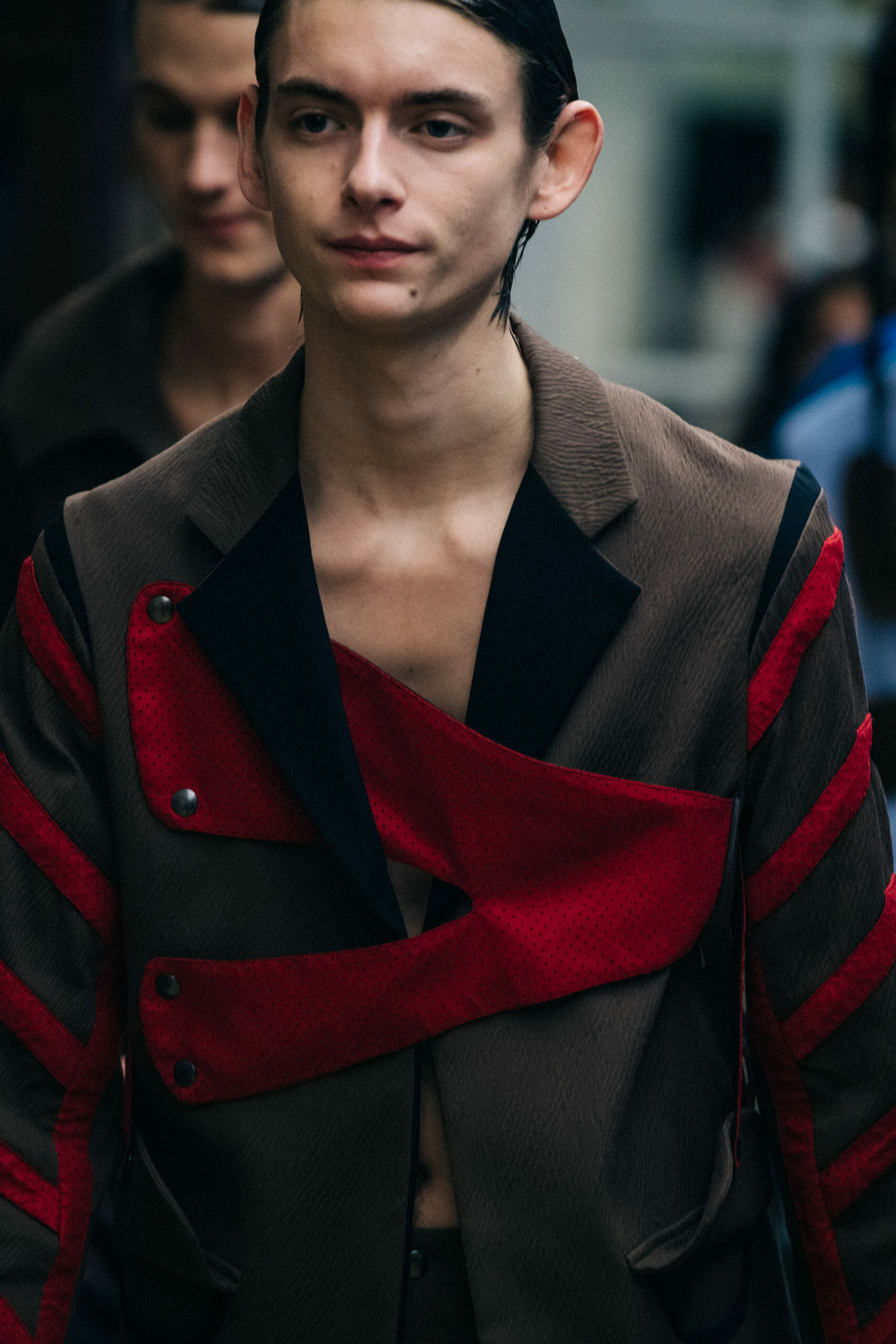 Models wearing red Kiko Kostadinov outfits
