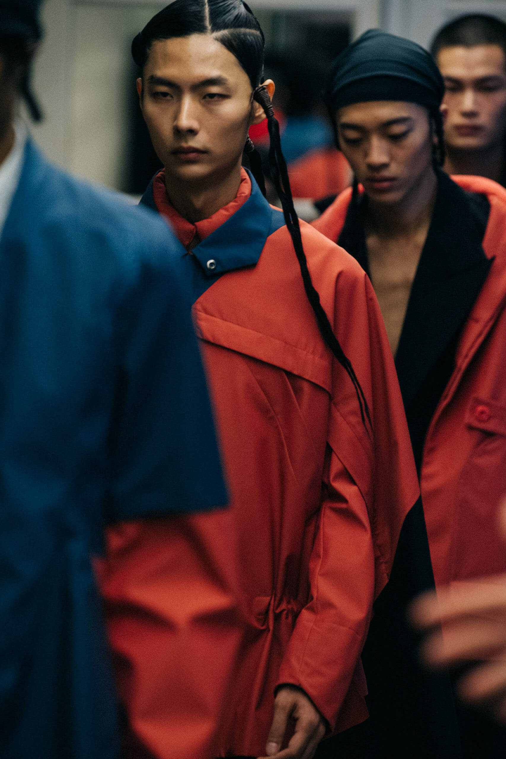 Models wearing red Kiko Kostadinov outfits
