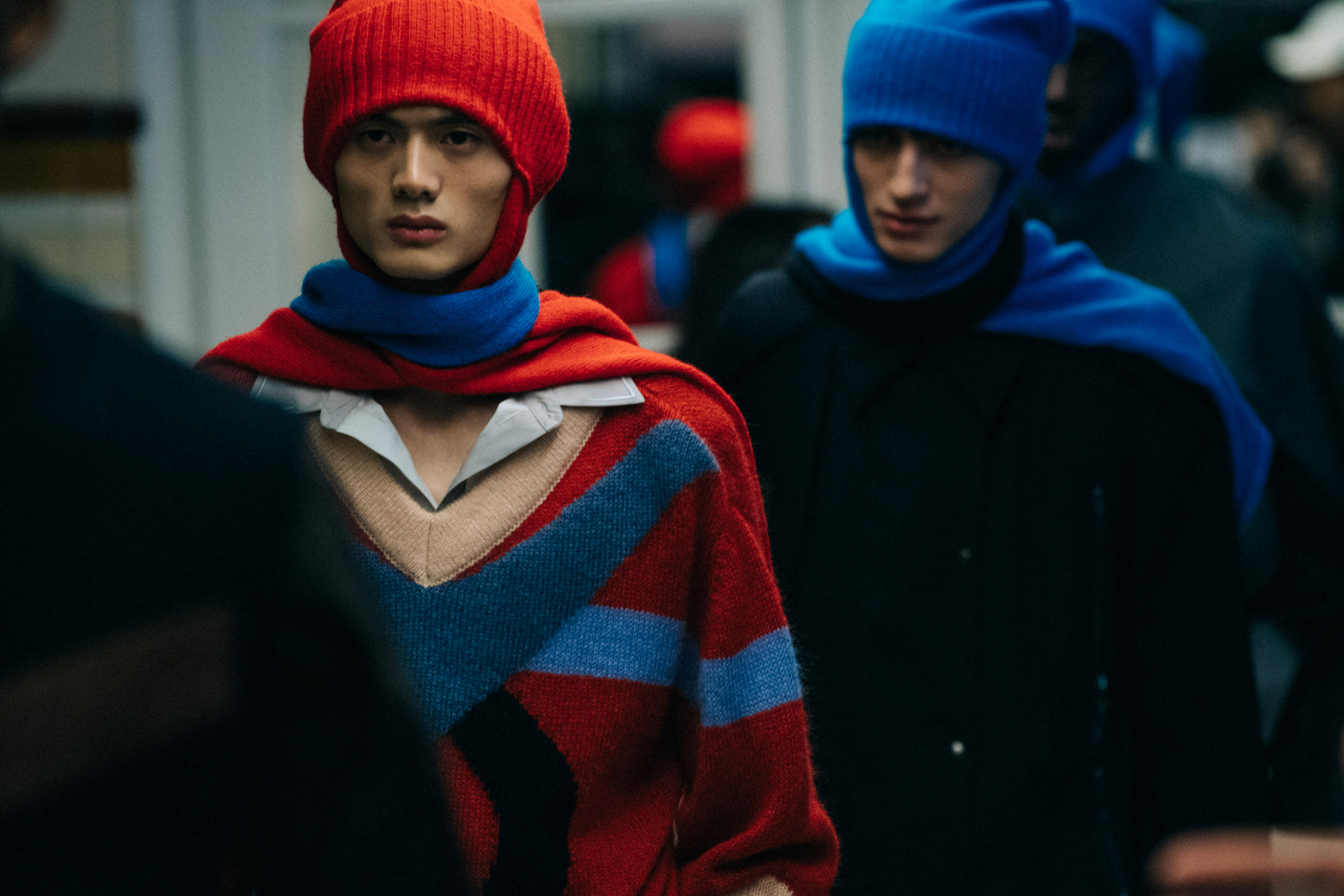 Models wearing red Kiko Kostadinov outfits