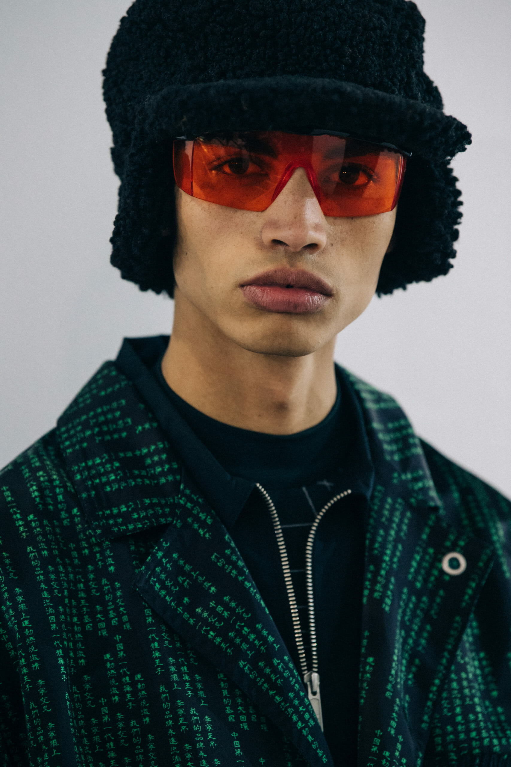 Model wearing red glasses at Li Ning