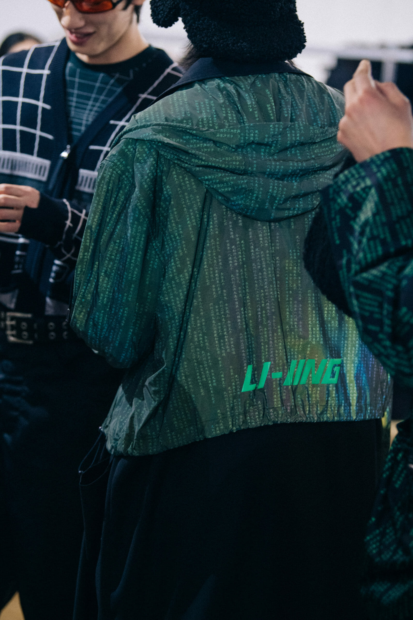 Models wearing coloured glasses at Li Ning