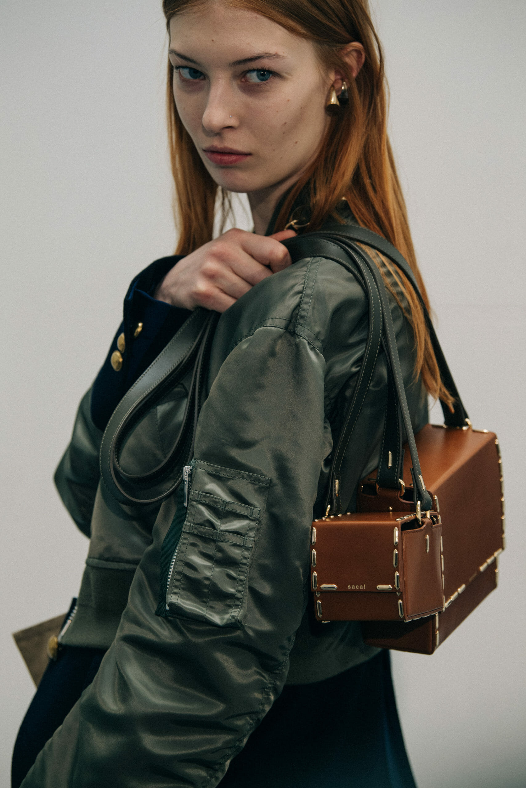 Model wearing green at Sacai