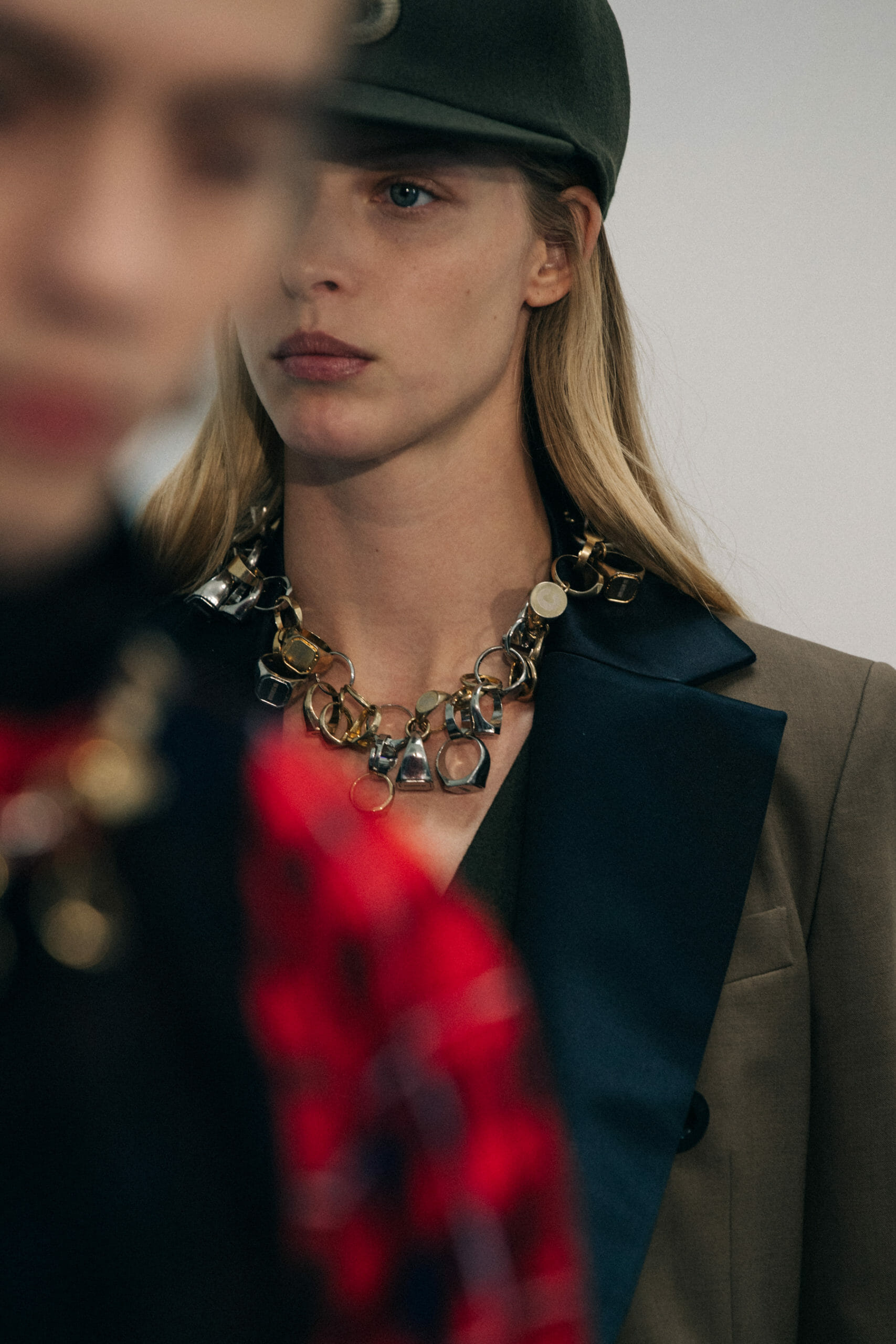 Model wearing green at Sacai