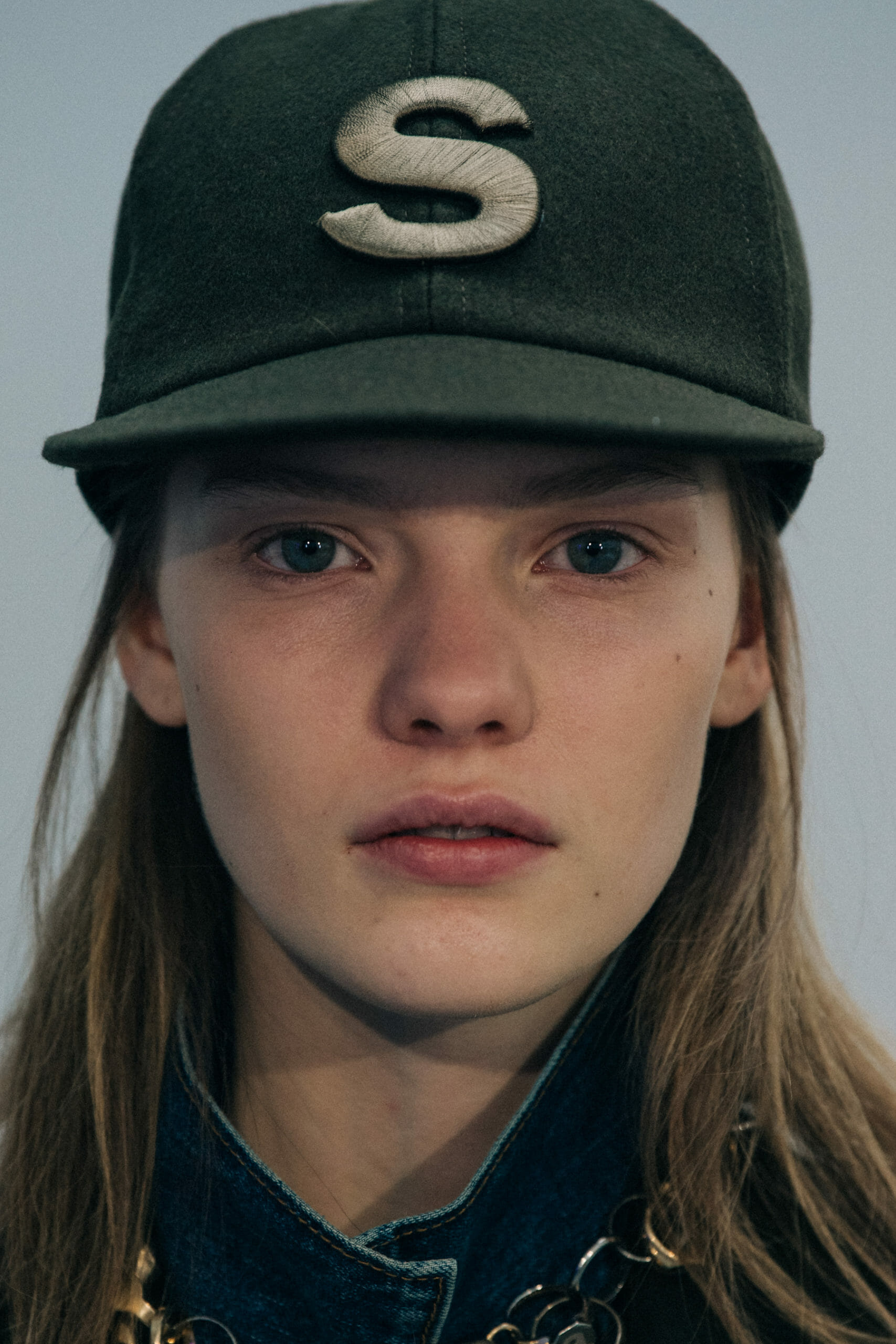 Models wearing Sacai caps