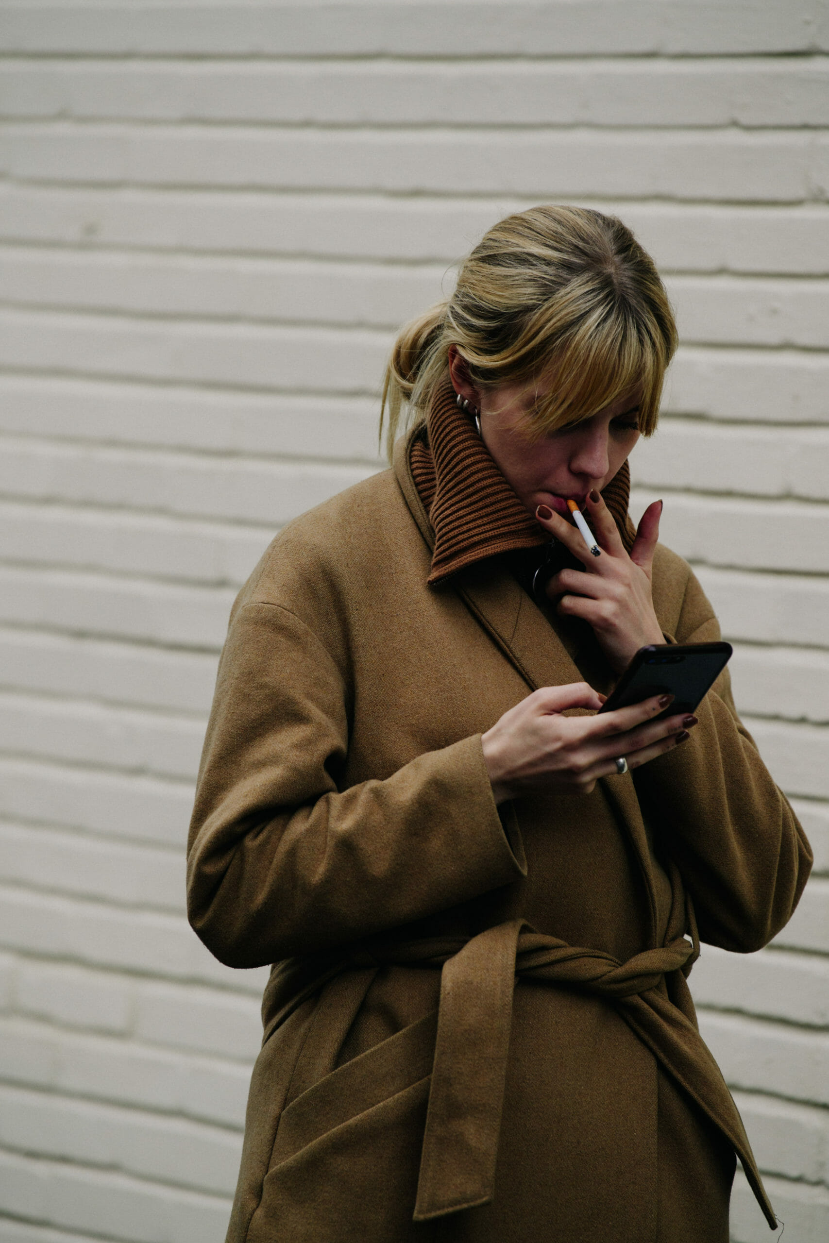 Woman wearing brown coat