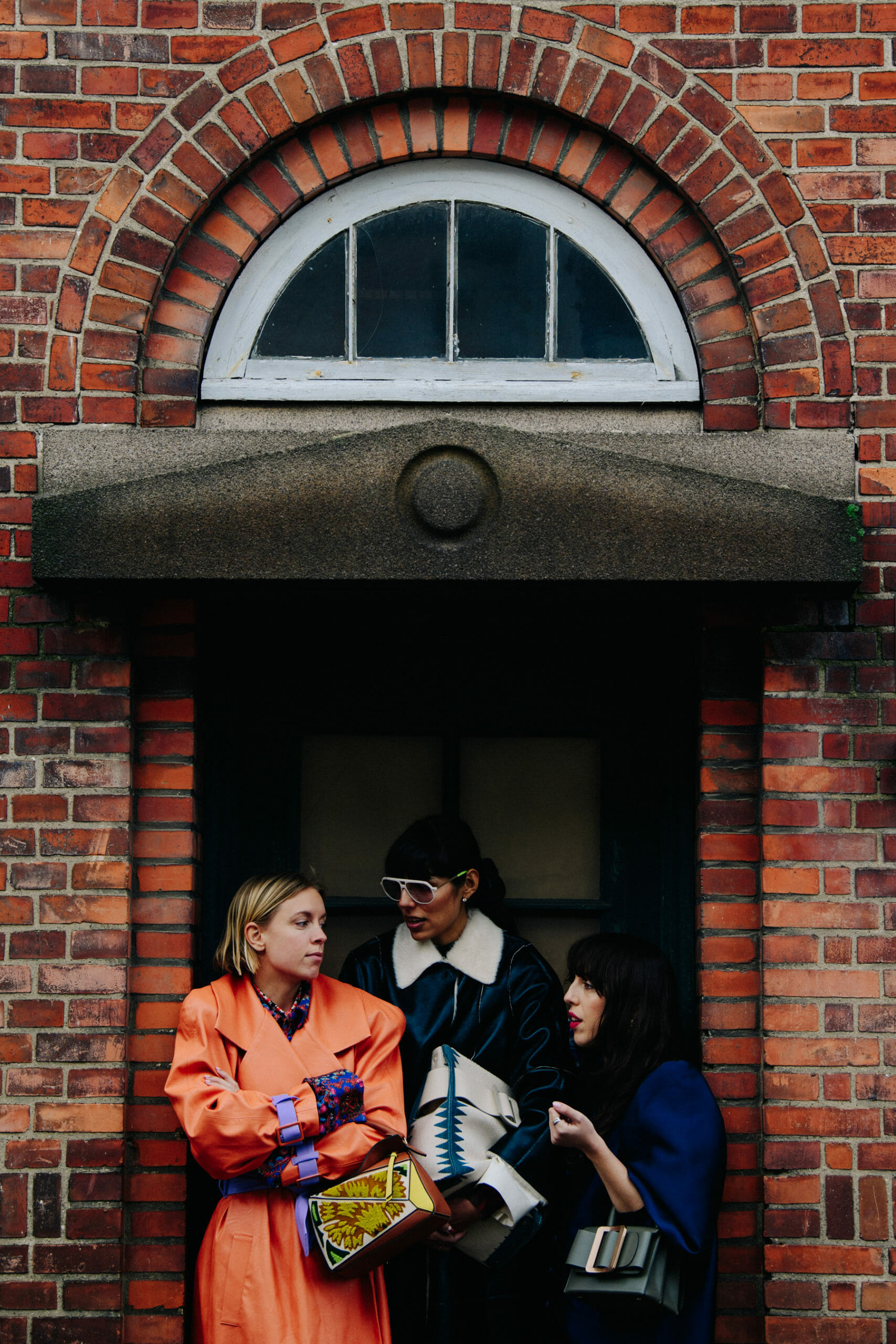 Three women wearing winter coats